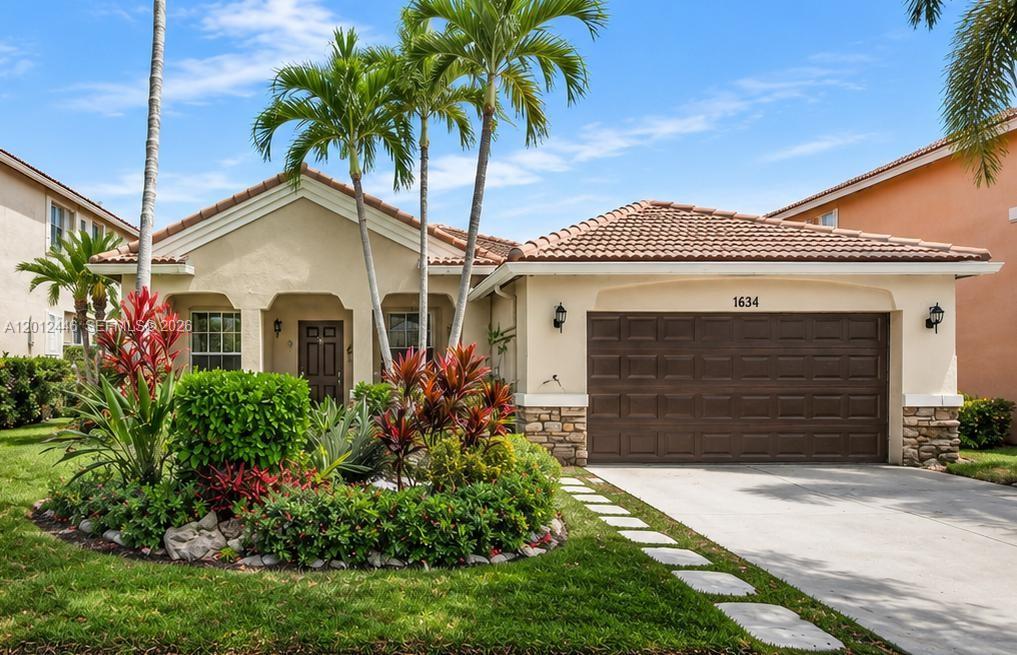 SELLER CREDIT TOWARD BUYER'S CLOSING COSTS WITH AN ACCEPTABLE OFFER. SPECTACULAR WATERFRONT POOL HOME IN THE HIGHLY SOUGHT-AFTER SAVANNA COMMUNITY! This beautifully maintained 4-BEDROOM, 2.5-BATH residence offers breathtaking lake views, a private pool, and an expanded screened patio—perfect for entertaining, relaxing, and enjoying stunning Florida sunsets. The spacious, light-filled floor plan features an upgraded kitchen, updated bathrooms, and inviting living spaces designed for comfortable everyday living. Enjoy significant energy savings with SOLAR PANELS INSTALLED IN 2024 (TRANSFERABLE LIFETIME WARRANTY) and a 220V ELECTRIC VEHICLE CHARGER in the garage. Additional features include HURRICANE-IMPACT WINDOWS ALONG THE REAR OF THE HOME and ACCORDION SHUTTERS THROUGHOUT for added protection and peace of mind. Experience RESORT-STYLE LIVING with Savanna's exceptional amenities, including a clubhouse, multiple pools, mini golf, pickleball courts, basketball courts, soccer fields, playgrounds, and more. ZONED TOP-RATED SCHOOLS: CYPRESS BAY HIGH SCHOOL, FALCON COVE MIDDLE SCHOOL, AND GATOR RUN ELEMENTARY SCHOOL. Ideally located near shopping, dining, major highways, airports, and South Florida's beautiful beaches. RARE OPPORTUNITY TO OWN A WATERFRONT POOL HOME IN WESTON AT AN EXCEPTIONAL VALUE!