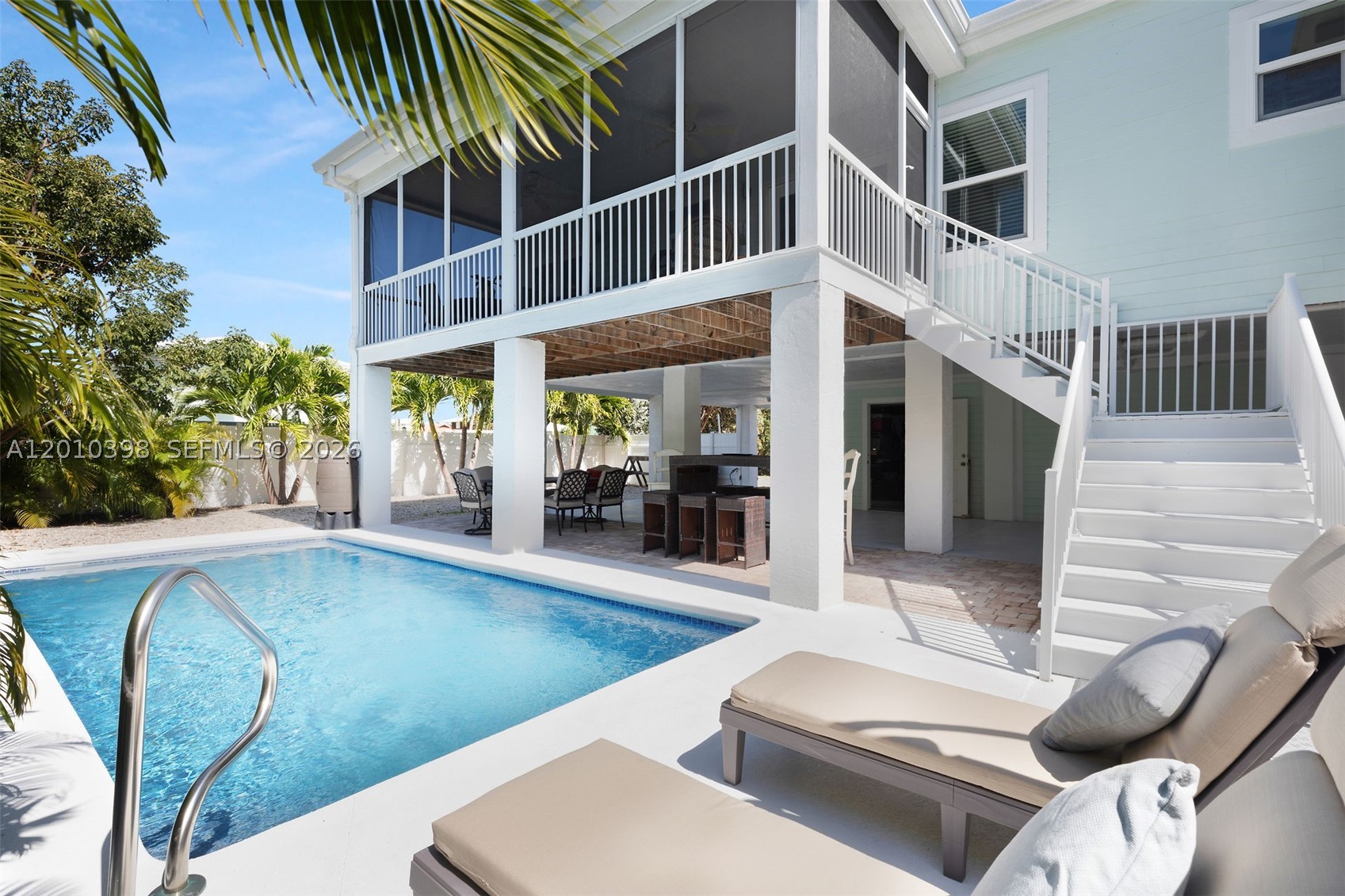 Turnkey Investment Opportunity just 0.3 miles from iconic Sombrero Beach, generating an impressive $116,000 in short-rental income in 2025. Fully furnished and 100% rental-ready, this property includes local rental management & future bookings already in place- allowing a new owner to step in and start earning immediately! Enjoy the best of Keys living with a heated pool, lush private fenced yard and multiple porches including screened spaces for seamless indoor-outdoor living. Inside, the open-concept layout features abundant natural light and a modern kitchen ideal for entertaining. Built in 2016 to modern hurricane standards with impact windows, impact doors and durable Hardie board siding, plus covered parking and ample storage below, this home is as functional as it is inviting. Experience the best of island living near the beach while benefiting from consistent rental income- without the expense and upkeep of a seawall or dock.