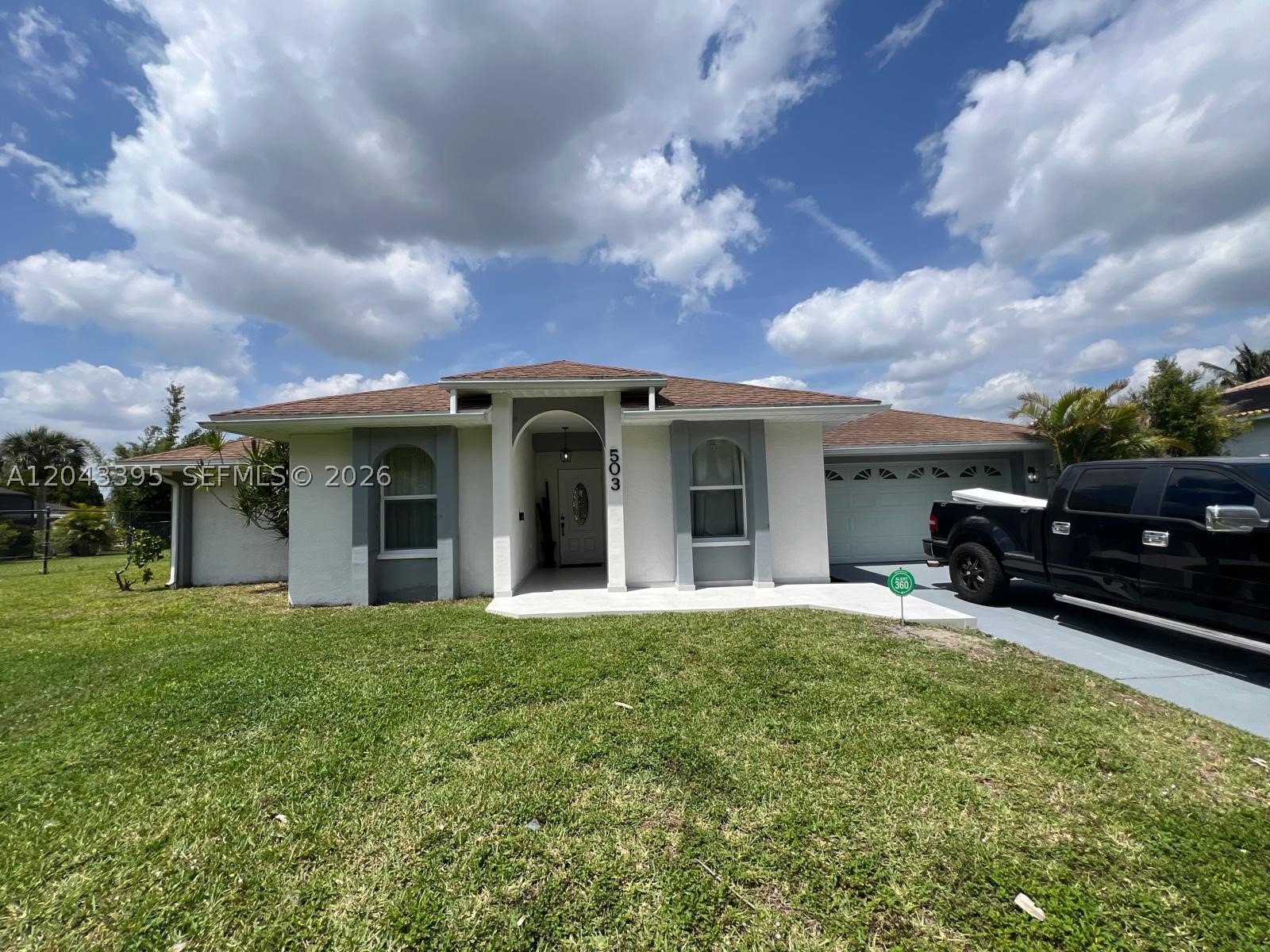 Beautifully updated 3-bedroom, 2.5-bath lakefront home in Lehigh Acres! Designed with modern living in mind, this home features an open-concept floor plan highlighted by a stunning kitchen with white wood cabinetry, quartz countertops, and stainless steel appliances. Hurricane impact windows and doors provide added security and peace of mind, while newly installed luxury vinyl flooring flows seamlessly throughout the home. All bathrooms have been tastefully renovated with modern finishes. Step outside to your private backyard oasis featuring a spacious patio, sparkling pool, and tranquil lake views—perfect for entertaining family and friends or simply relaxing while enjoying the waterfront setting.