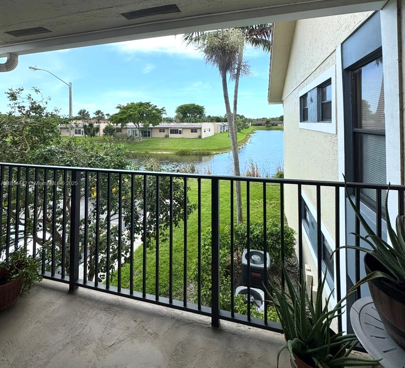 Beautiful second-floor, 2 bedrooms and 1 bathroom condo. Boasts modern features, kitchen and bathroom with granite countertops and stainless steel appliances. Entire unit features tile flooring. Enjoy the convenience of an in-unit washer and dryer and relax on your private balcony. The condo features spacious bedrooms filled with natural light from large windows, offering a bright and airy ambiance. Centrally located just minutes away from Okeechobee Rd, Turnpike, and 441. Benoist Farms Elementary is within walking distance, adding extra convenience for families. Investor-friendly community--can be rented on Day 1! With quick access to main roads and highways, this unit won't last long! Perfect for investors or homeowners alike. Don't miss the chance to call this place home!`