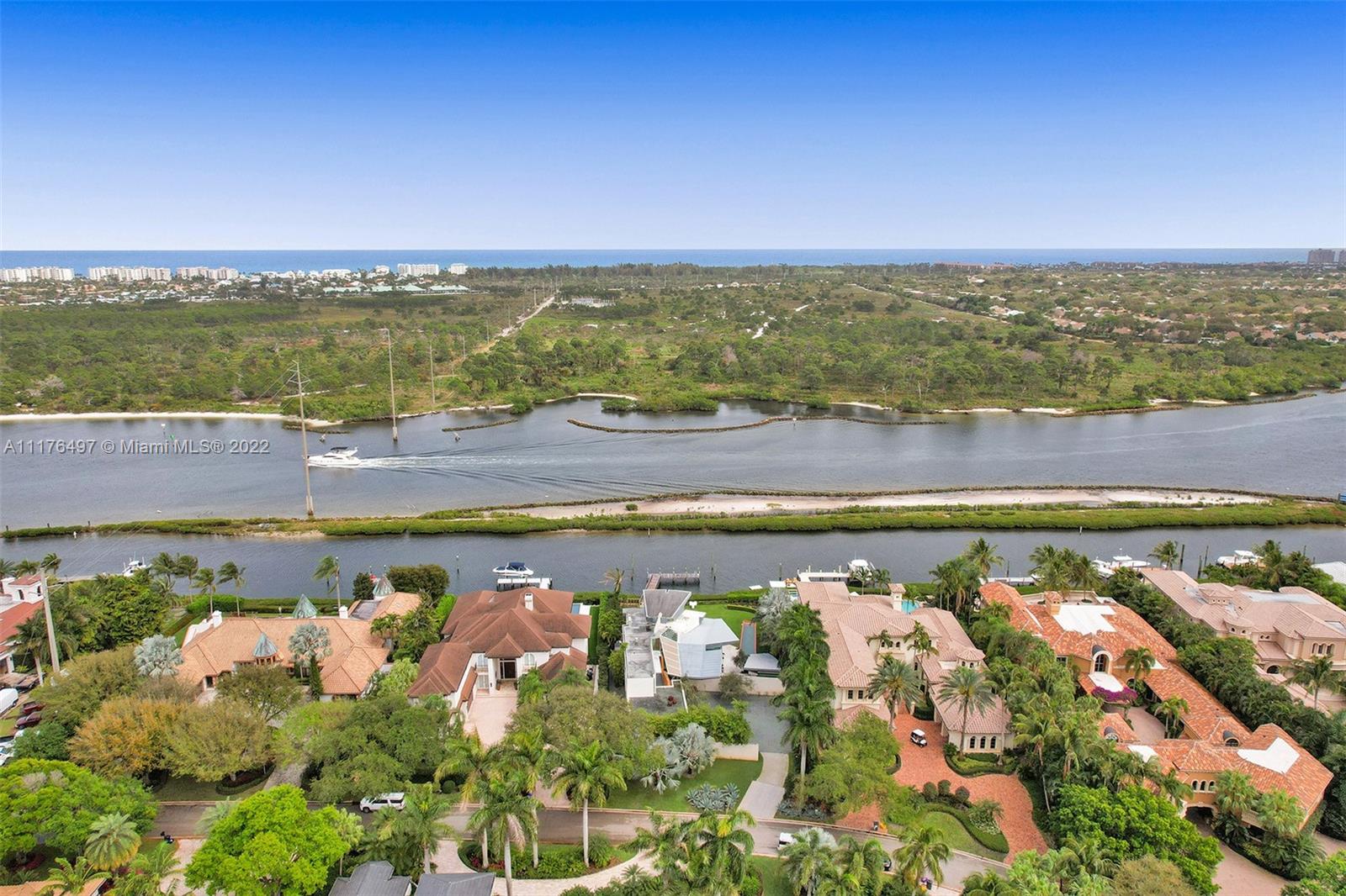 Once in a lifetime opportunity to own a magnificent waterfront home facing a barrier island with private channel to ocean access in Admirals Cove. The architectural masterpiece was designed by renowned architect Frank Israel and featured in Architectural Digest. Upon entering, you’re greeted with double height ceilings and floor to ceiling glass walls streaming sunlight and breathtaking water views. Move to the oversized kitchen, a chef’s dream with an abundance of counter space and storage, perfect for any holiday or dinner party. The second floor has 5 bedrooms including a fairytale primary suite with wide water view, separate his/hers en-suite bathrooms and closets. Guest bedroom/bath house with separate entrance. Mandatory Admirals Cove golf membership.