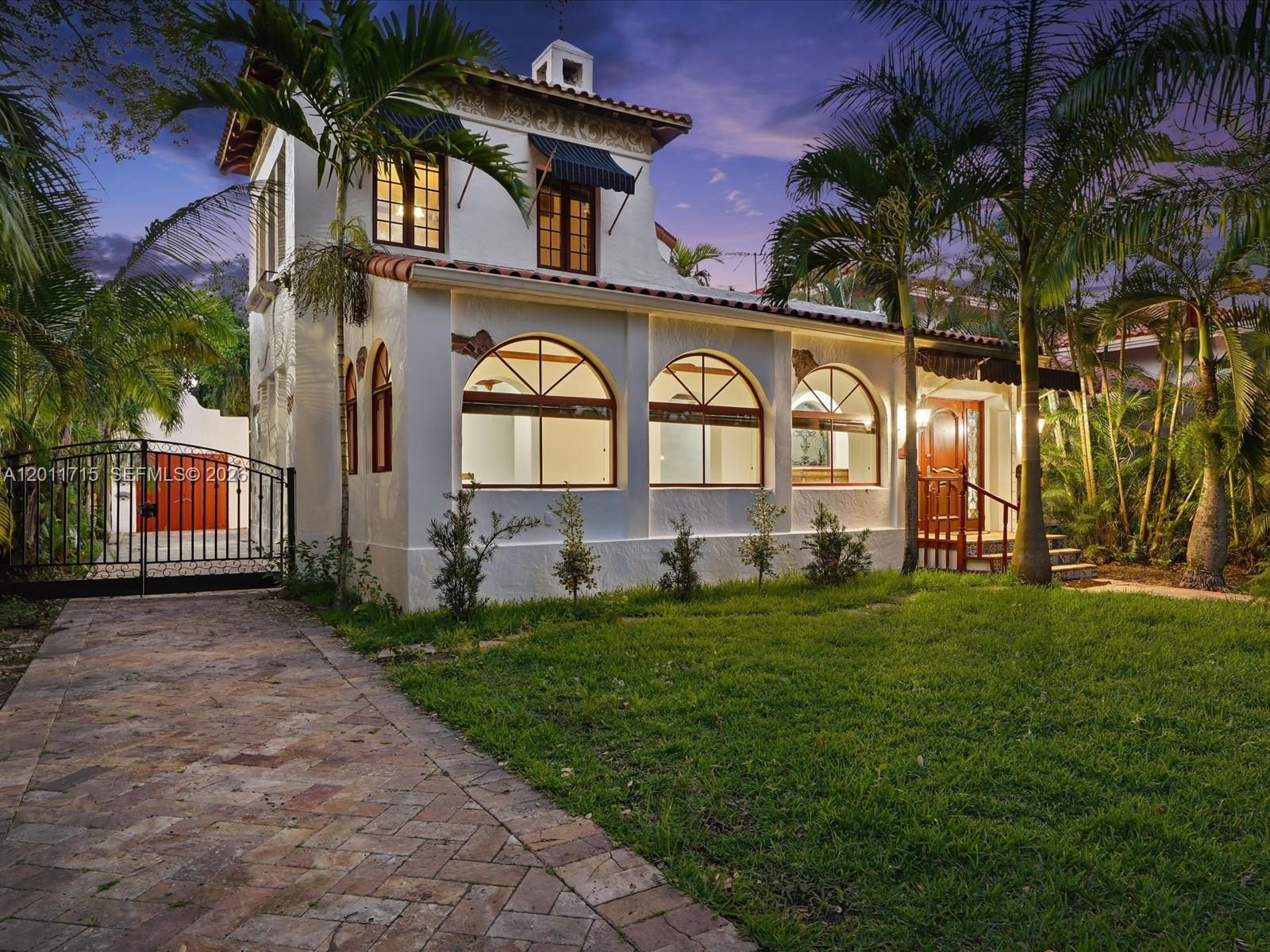 Beautiful Spanish Colonial home built in 1923, a Coral Gables landmark rich in history, once a consular residence. The house was designed by the renowned architect Walter De Garmo who was the Coral Gables leading architect, chosen by the city founder George Merrick. Ideally located near Granada Golf Course, the Biltmore Hotel, and Miracle Mile. Showcasing ornate façade details and timeless character throughout.

The main home offers 3 bedrooms and 3 bathrooms, with elegant living spaces including formal living and dining rooms plus a bright Florida room. Handcrafted mahogany floors, a classic fireplace, and abundant natural light enhance its charm. The primary suite is set on the second floor in a unique tower layout, featuring a walk-in closet and en-suite bathroom. The kitchen includes a gas range with heavy-duty stove. Impact windows and doors.

A separate guest suite with private bath sits in a rear building—ideal for visitors. Enjoy a beautiful backyard patio, perfect for entertaining. Renovated over the years with brand-new appliances, blending historic elegance with modern comfort.