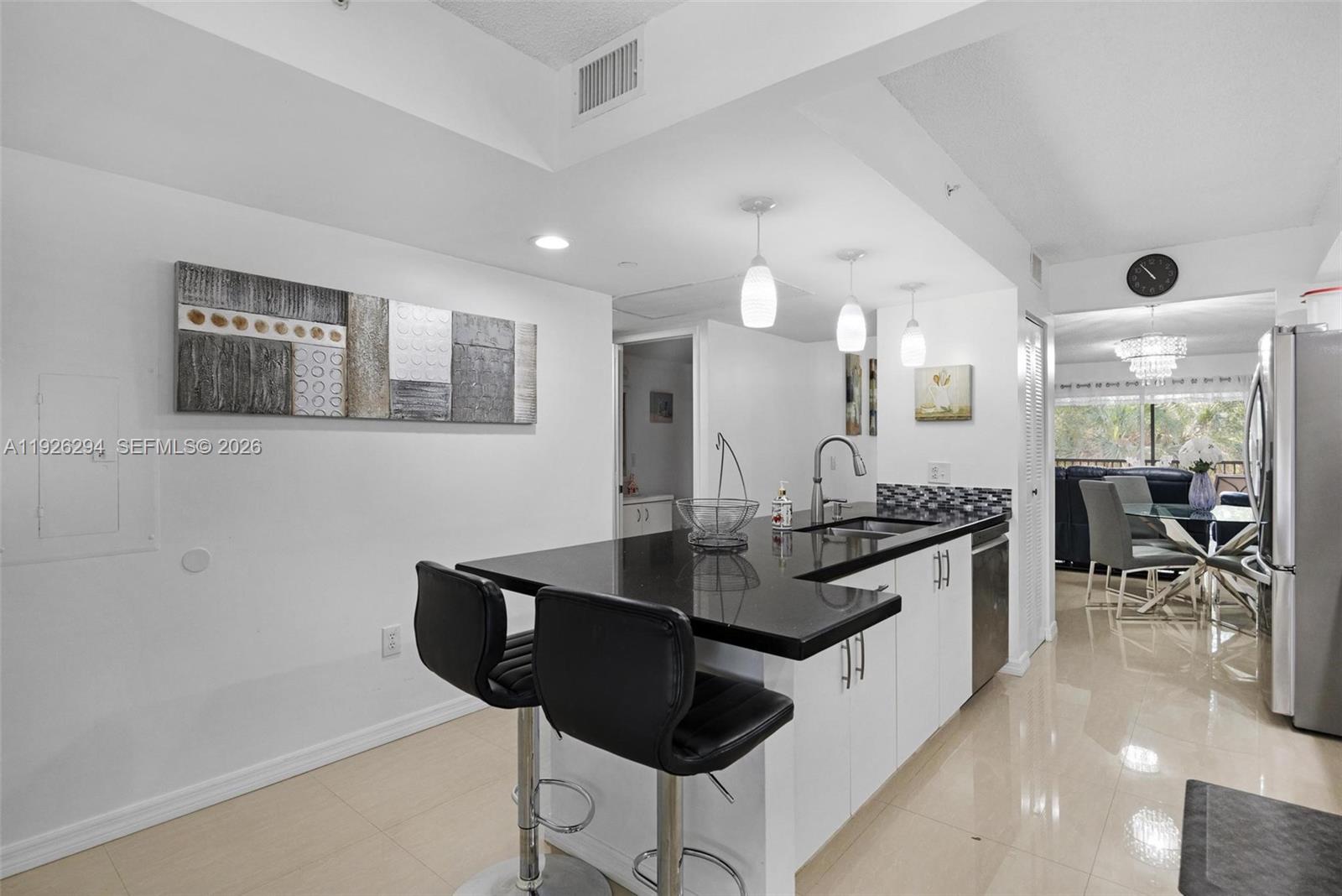 Beautifully updated 2/2 condo in the highly desirable 55+ community of Century Village.

Modern kitchen with quartz countertops and stainless steel appliances,
In-unit washer and dryer,
Spacious primary bedroom with walk-in closet,
Elegant porcelain flooring throughout living areas and kitchen,
Hurricane shutters for peace of mind,
Private balcony with tree-filled, peaceful views,
Enjoy the resort-style lifestyle Century Village offers:
Incredible amenities including clubhouse, pools, fitness center, and social activities,
24/7 security and gated entrance,
Maintenance includes water, cable, and internet. 

Experience exceptional active adult living in a welcoming community — perfect for buyers looking for comfort, convenience, and lifestyle.
