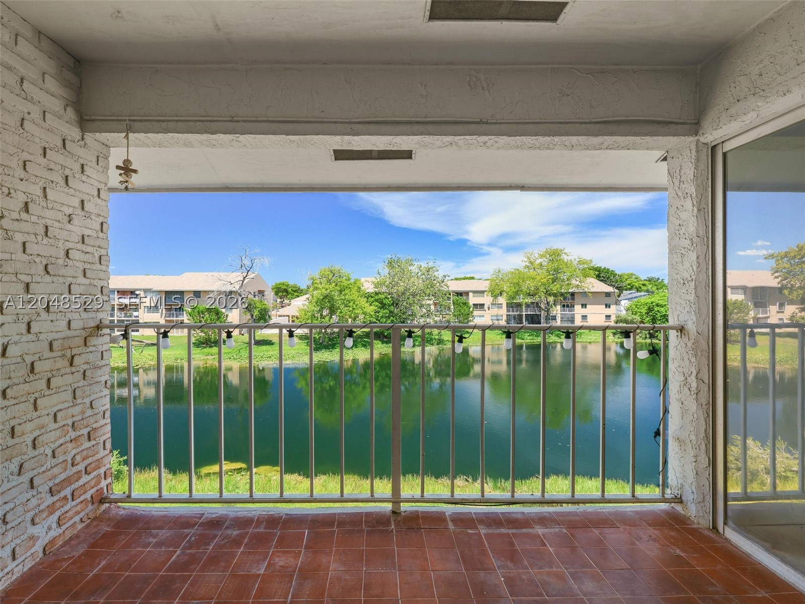 Beautiful and spacious 3-bedroom, 2-bath apartment in the heart of Southwest Miami. This bright and inviting home features Spanish tile flooring throughout, an open-concept living and dining area filled with natural light, and a private balcony overlooking a tranquil lagoon. The kitchen offers wood cabinetry, marble countertops, ample storage, and generous workspace, making it ideal for everyday living and entertaining. The functional split-bedroom layout provides both privacy and comfort. Conveniently located near major highways, shopping, dining, parks, and top-rated schools. Vacant and move-in ready. Easy to show—schedule your private tour today. Seller Motivated.
