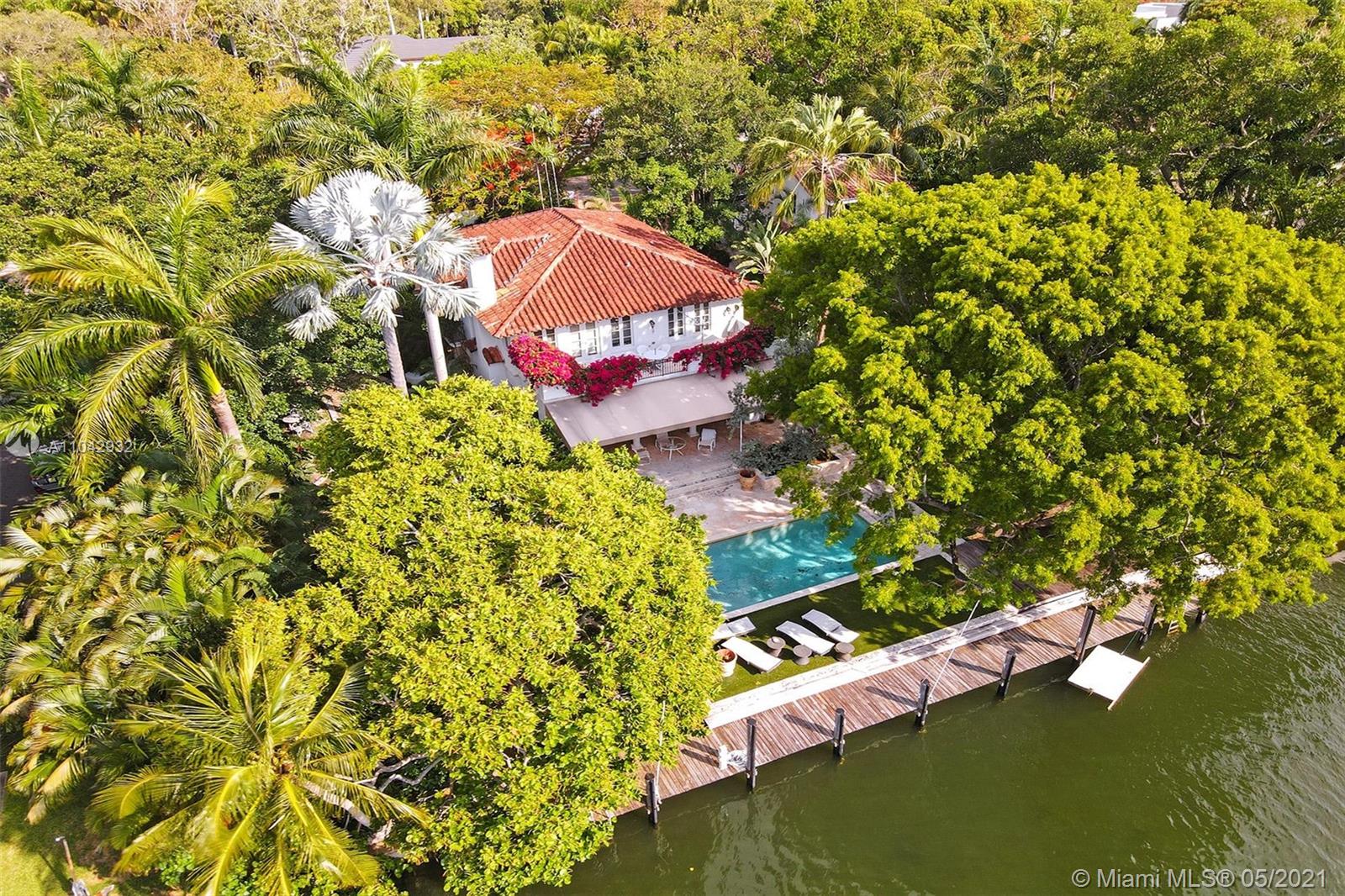 Centrally located in historic area,  Colee Hammock, within walking distance to Las Olas Blvd. In the premier Yachting paradise, boasting over 150' waterfront, the home is set back from the busy new river traffic and offers privacy and serenity. The open kitchen has a Wolfe range and Miele appliances. French Oak floors grace the downstairs. Completely renovated in 2014/15 main house has formal dining room, formal living with wood burning fireplace, the Family/Tv room (also be the downstairs 4th bedroom.) 
The upstairs master has a large terrace with steps to walk down to the pool. 
 The over 1/2 acre property is over the top with tropical landscaping. The gem of the backyard is a Mahogany tree shading some of the Dominican coral tile pool deck. There's even a private jungle grotto. cont->
