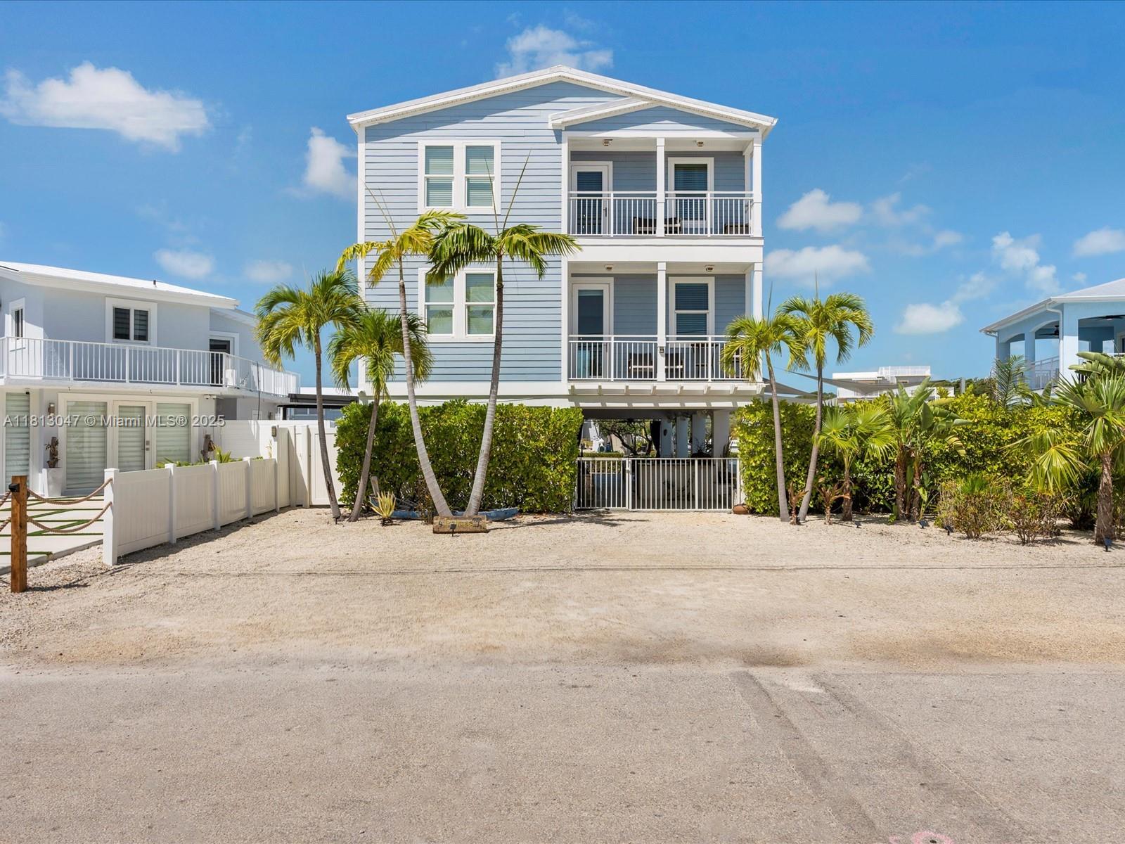 Turn-key tropical luxury in Key Largo! 4 Palmas is a custom 5BD/4.5BA waterfront oasis built in 2016 with over 5,600 sqft of indoor/outdoor living. Designed for entertaining & relaxation, it features 2 primary suites, open living spaces, 3 lounges (incl. covered outdoor), 2 bars, full outdoor kitchen, heated pool, and expansive deck. Enjoy a 50’ dock on a wide canal with direct ocean access, plus kayaking through nearby mangroves of Pennekamp. Built to CAT 5 standards with impact windows/doors, metal roof, elevator, balconies & ample storage. Available fully furnished - this home is ready to enjoy—live the Keys lifestyle in comfort, style, and ease!