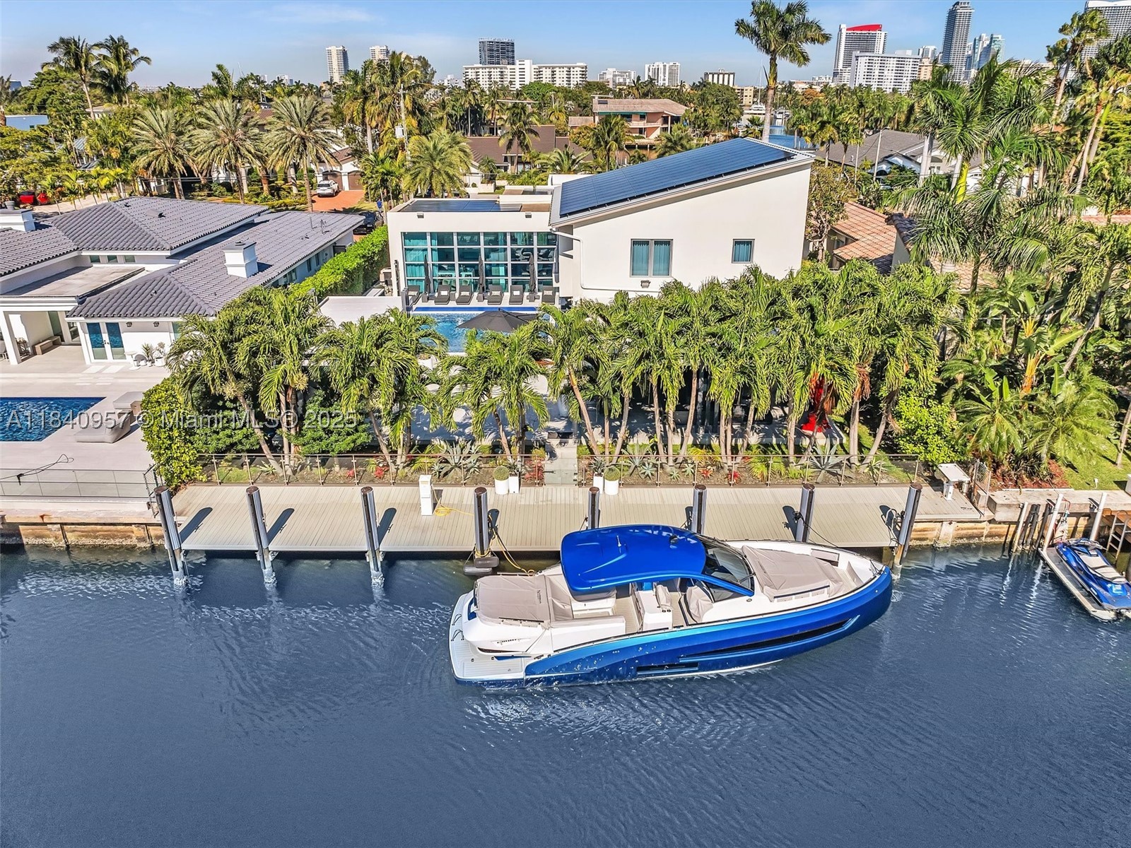 Experience the ultimate waterfront lifestyle in this contemporary estate in the guard-gated Golden Isles. This move-in-ready home features a sleek, modern design with abundant natural light and high-end finishes. The open layout includes spacious living, dining, and family areas, plus a chef-style kitchen with water views. Upstairs, the private master suite offers a spa-inspired bath, sitting area, and balcony. Enjoy the outdoors with a resort-style heated pool, summer kitchen, and large patio. Boaters will love the 85 feet of deep-water frontage, full-service dock, no fixed bridges, and no wake zone. A rare home in one of South Florida’s most desirable waterfront communities.