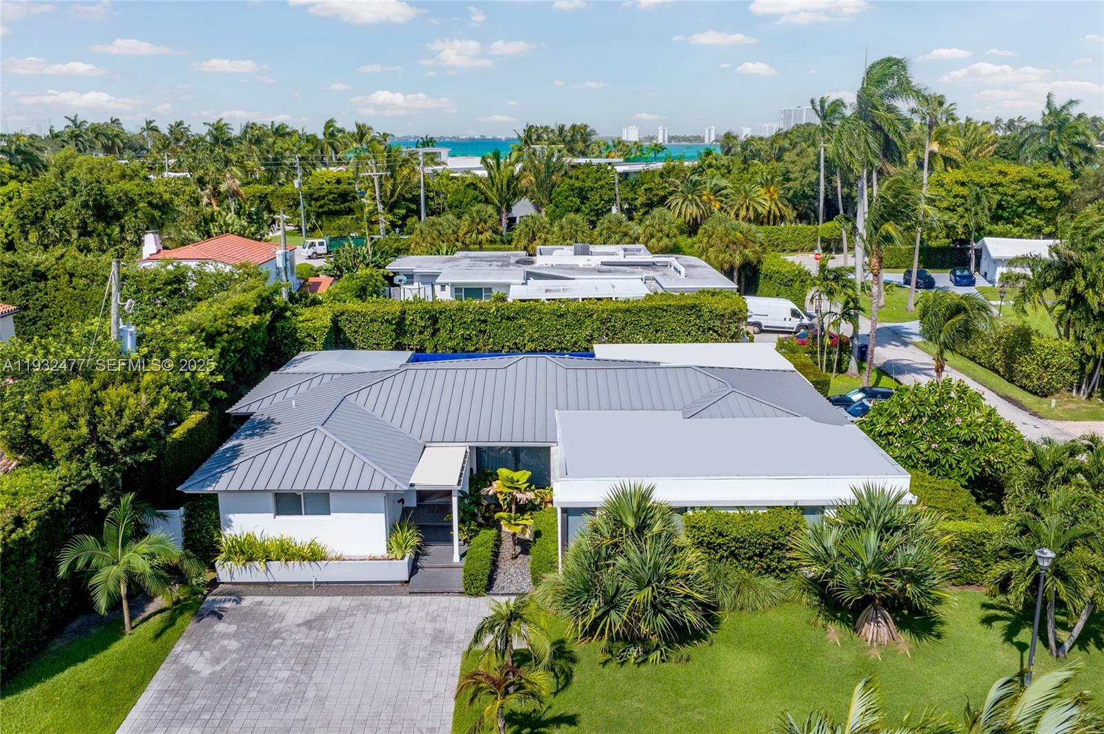 Nestled on one of Miami Beach’s most exclusive streets, this exquisitely renovated single-story 5 bed / 5.5 bath residence sits on a coveted corner lot, blending timeless sophistication with modern luxury. Features include a newly designed resort-style pool, summer kitchen for outdoor entertaining, new roof, hurricane-impact windows and doors, state-of-the-art security, smart home technology, and a spacious 2-car garage. The chef’s kitchen boasts Sub-Zero and Wolf appliances and a striking marble island. The primary suite features dual walk-in closets, including a lavish boutique-style closet designed for her. Just moments from the brand-new La Gorce Park and minutes from Bal Harbour, Sunset Harbour, and Miami’s finest destinations.