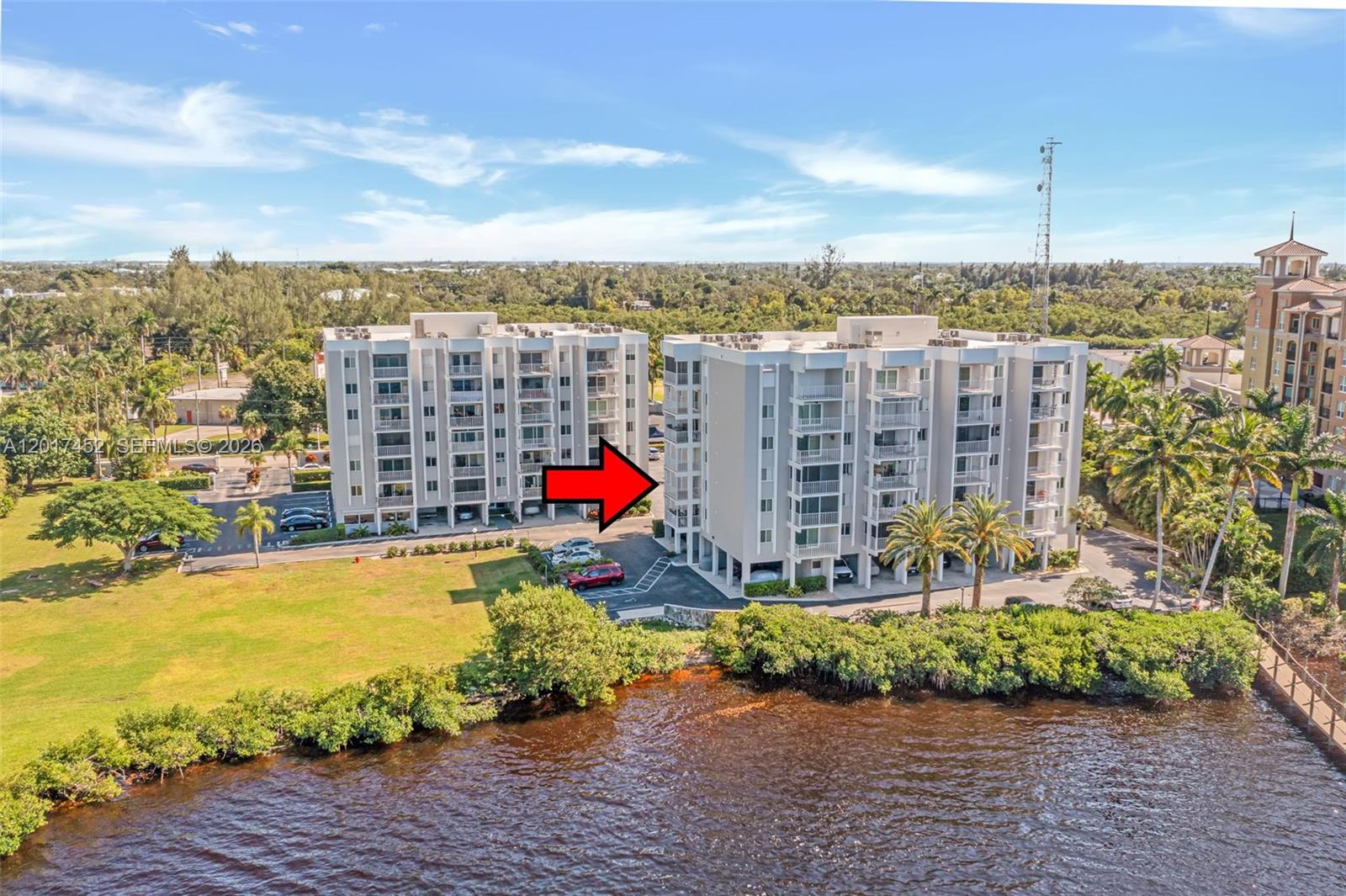 Experience relaxed waterfront living in this well-kept 2-bedroom, 2-bath condo located in a desirable boater’s community with direct river frontage and Gulf access. This inviting home offers tile flooring throughout, a bright and tidy kitchen, and a comfortable living area that opens to a private balcony overlooking the scenic Caloosahatchee River. The primary suite features an en-suite bath and tranquil water views. Enjoy a range of great amenities including a private boat slip, secure dry storage, fishing pier, riverside BBQ and picnic areas, a sunny pool deck with spa, and a welcoming clubhouse. Ideally situated just minutes from the vibrant downtown River District with its restaurants, shops, and local events, this community offers the perfect blend of convenience and charm.