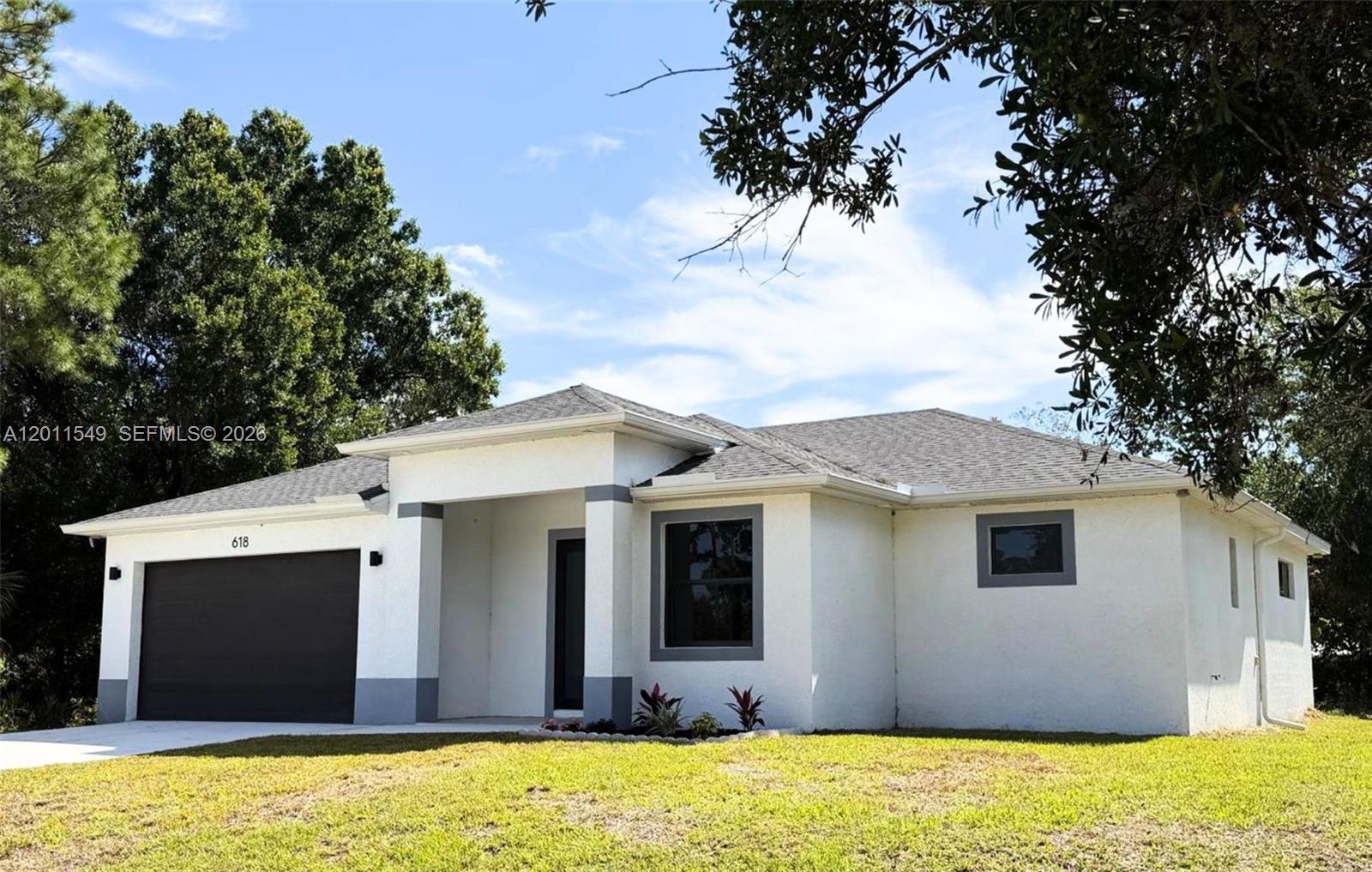 Discover the perfect balance between contemporary design and asmart real estate investment. Located in an excellent neighborhood experiencing rapid growth, this new construction home is not just aresidence, but an opportunity to secure solid equity in one of Southwest Florida’s most promising areas. Situated on a generous half-acre lot(.50 acres), this 3-bedroom + den + 2.5-bathroom home stands out for its privacy and endless possibilities. Upon entry, you are welcomed by aflexible space ideal for a home office or studio, complemented by a convenient powder room for guests. The heart of the home is asophisticated chef's kitchen, featuring elegant granite countertops and stainless-steel appliances. This space integrates seamlessly into thesocial area, where 10-foot elevated ceilings create a constant flow of natural light. The Great Room offers total versatility to customize thelayout according to your lifestyle. The primary suite is a true retreat, boasting double walk-in closets and a designer bathroom with afreestanding tub and separate shower. For your peace of mind, the property features full impact windows and doors, a two-car garage, andhigh-quality finishes throughout. This property provides unparalleled freedom, offering plenty of space for a pool or additional vehicles, No HOA.I invite you to discover the space where your wealth and lifestyle will grow together.