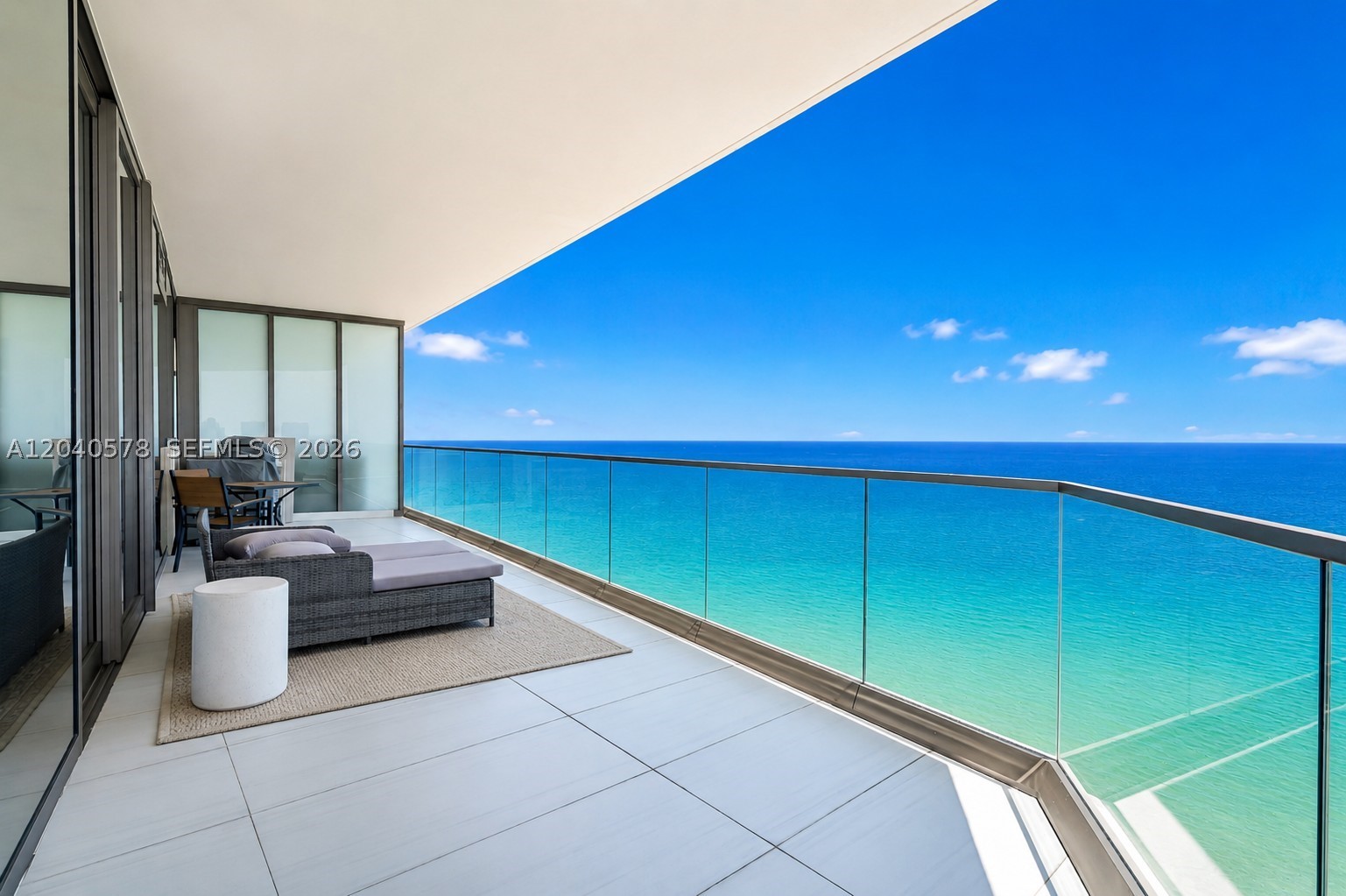 Enjoy perfectly designed elevated ocean-front living at the luxurious Residences by Armani Casa. 
Created by world-class architect Cesar Pelli with impeccable interior design by the acclaimed fashion designer Giorgio Armani. This bright corner residence has direct ocean, city and intra-coastal views with a spacious open floor-plan and 10 foot ceilings, allowing plenty of natural light in all the living areas. Beautifully finished and furnished by a professional interior designer, this stunning residence offers, 2 bedrooms plus an enclosed Den and 2.5 bathrooms. Expansive 1,600 sq ft floor plan plus additional 400 sq ft balcony showcasing breathtaking azure ocean views and equipped with a full summer kitchen. 
Luxury finishes throughout the Sky Home include Armani designed Dada kitchen featuring Wolf and Sub-Zero appliances, plus spa-like marble Armani Roca bathrooms and 10 ft deep balconies. 
Armani Casa offers over 30,000 sq ft of the finest resident amenities in Sunny Isles Beach including cafe and restaurant, fitness and spa, movie theater and club house, resident social events and many more.