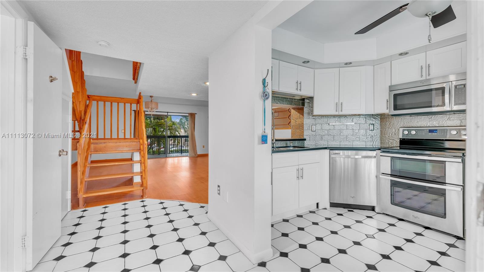 Delightful 2-story condo centrally located in the heart of Kendall. Featuring an updated kitchen with stainless steel appliances, spacious living and dining room, large balcony with washer and dryer, accordion shutters and more. Bedrooms are located upstairs. This unit has a good size master bedroom with a spacious loft and large walk in closets. Plenty of guest parking for visitors. Association includes exterior insurance, water, and roof. Walking distance to restaurants and shopping.