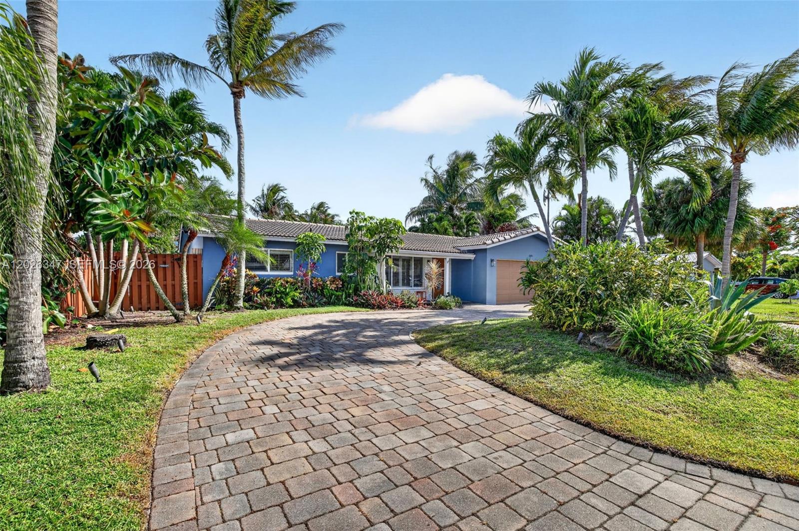 Tropical poolside retreat located in one of Northeast Fort Lauderdale’s most desirable neighborhoods! This inviting 2-bedroom, 2-bath residence with additional sunroom/family room and separate poolside efficiency offers the perfect blend of comfort, flexibility, and South Florida charm just minutes from the beach, shopping, dining, and I-95. Inside, the home features spacious living areas filled with natural light, crown molding, and a spacious kitchen with rich wood cabinetry, granite countertops, breakfast bar seating, and open flow into the main living spaces. The oversized primary suite offers private French door access to the outdoor living space. A stunning sunroom/family room with vaulted wood-beam ceilings overlooks the lush tropical backyard and sparkling saltwater pool, creating the ideal setting for relaxing or entertaining year-round. The private outdoor oasis is surrounded by mature landscaping, expansive patio space, and privacy fencing, while the separate efficiency provides excellent flexibility for guests, extended family, home office, or additional income potential. No HOA. OK to lease.