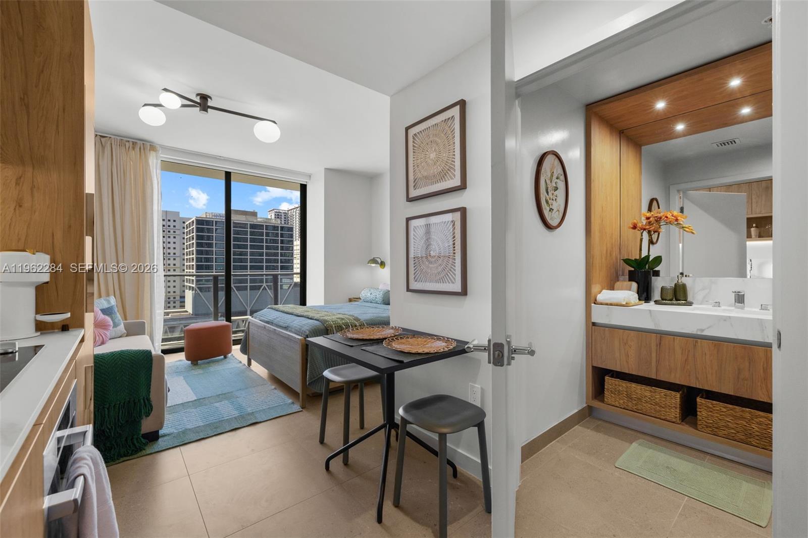 Spectacular turnkey, fully furnished studio residence at The Crosby Miami Worldcenter, located in the heart of Downtown Miami / Miami Worldcenter. This modern studio features floor-to-ceiling windows, an efficient open-concept layout, and a contemporary kitchen with custom Italian cabinetry and integrated Bosch appliances. With smart-home technology and a full-size washer and dryer for everyday convenience. The Crosby allows short-term rentals with no rental restrictions, making this residence ideal as a primary home, second home, or investment. Residents enjoy over 22,000 square feet of world-class amenities, including a rooftop resort-style pool and jacuzzi with cabanas, private rooftop restaurant and bar, fire-pit lounge with skyline views, state-of-the-art fitness center, coworking spaces, clubroom, and 24/7 concierge. Prime location with unbeatable walkability to dining, shopping, entertainment, Brightline MiamiCentral, and major Miami landmarks.
