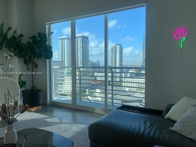 Enjoy Loft Living in downtown Miami!!!  It of a kind, beautiful corner unit with a wrap-around balcony with amazing city views!!  This spacious condo offers polished concrete floors throughout 10 Ft ceilings; Master Bedroom and a large Den/2nd Bedroom (Presently separated with curtain BUT HAS APPROVED CITY PERMITS TO ENCLOSE WITH WALL AND DOOR, included in the price).  Floor-to-ceiling Impact windows/doors, SS appliances, Washer/Dryer in-unit, Built-in closets, Remote Solar/Blackout Shades, and more! Great amenities: Rooftop Pool, Spa/Sauna, and Gym on the 36th floor with 360-degree views Lap Pool on the ground level, and 24/7 Front Desk Security. Metro Mover stops right below for easy access to downtown and Brickell
BEAUTIFULLY AND PROFESSIONALLY FURNISHED IF INTERESTED CAN BE NEGOTIATED