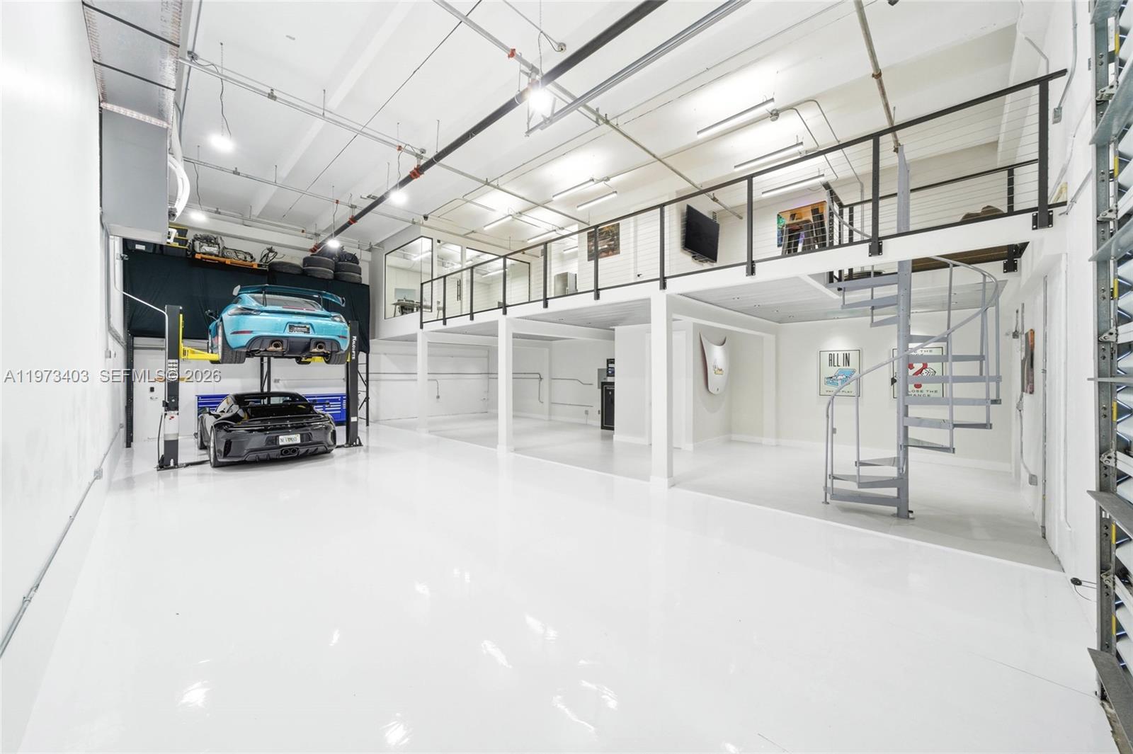 Rare, fully renovated warehouse opportunity offering 1,750 SF of thoughtfully designed space ideal for an owner-user, collector, or creative workspace. The property features new flooring throughout, a mezzanine area, full office build-out, kitchen, and full bathroom and half bathroom. The open warehouse layout allows for flexible use, and a car lift may be included in the sale price. A truly turnkey, one-of-a-kind industrial space located near Tamiami Airport, with seller financing available and limited inventory in this submarket.