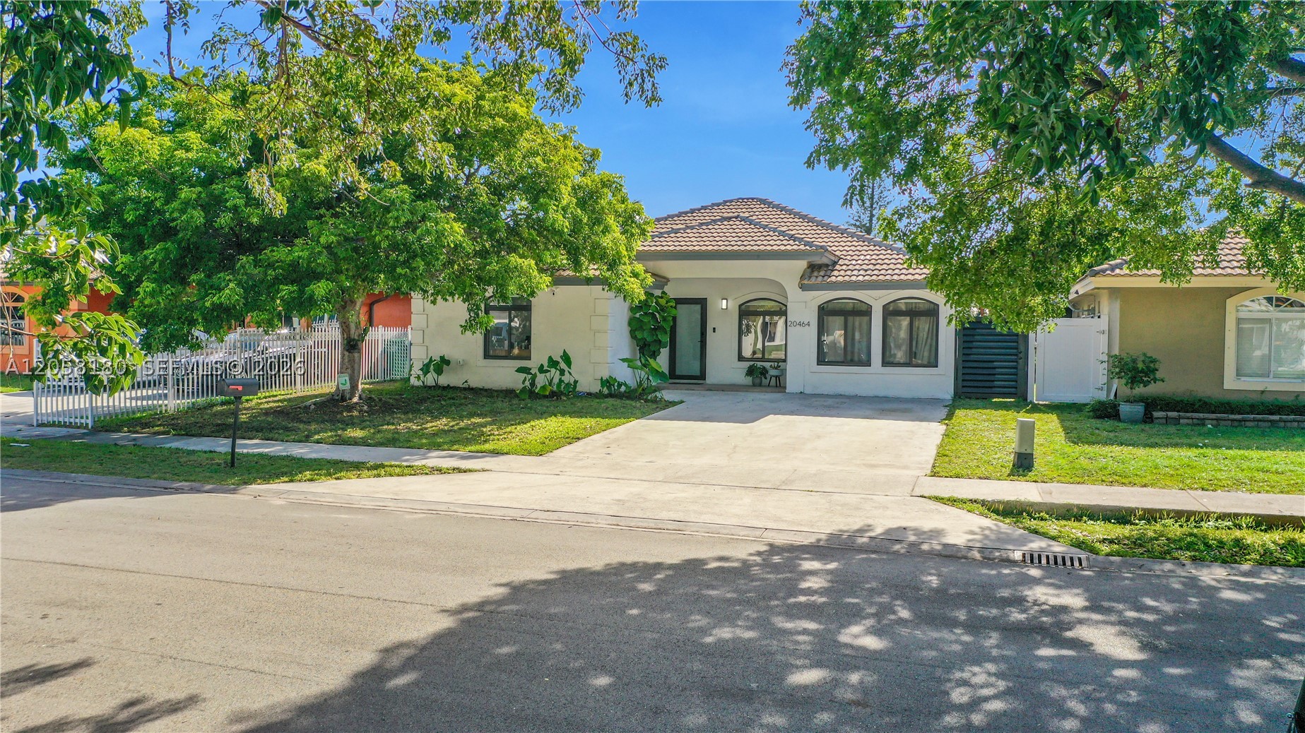 Beautiful single-family home featuring 4 bedrooms and 2 bathrooms. This modern residence offers stylish wall accents, waterproof vinyl flooring throughout, and a bright, open-concept floor plan. The spacious kitchen is equipped with stainless steel appliances and ample cabinetry, making it ideal for both everyday living and entertaining. The oversized primary suite features direct access to the patio and includes a generously sized walk-in closet. A large, fully equipped laundry room adds convenience and extra storage. Step outside to enjoy the spacious, fully fenced backyard overlooking the canal—perfect for relaxing, entertaining, or enjoying peaceful water views. Conveniently located just minutes from Hard Rock Stadium, the Florida Turnpike, shopping, dining, schools, and more. Don't miss the opportunity to own this move-in-ready home with modern finishes and an excellent location!
