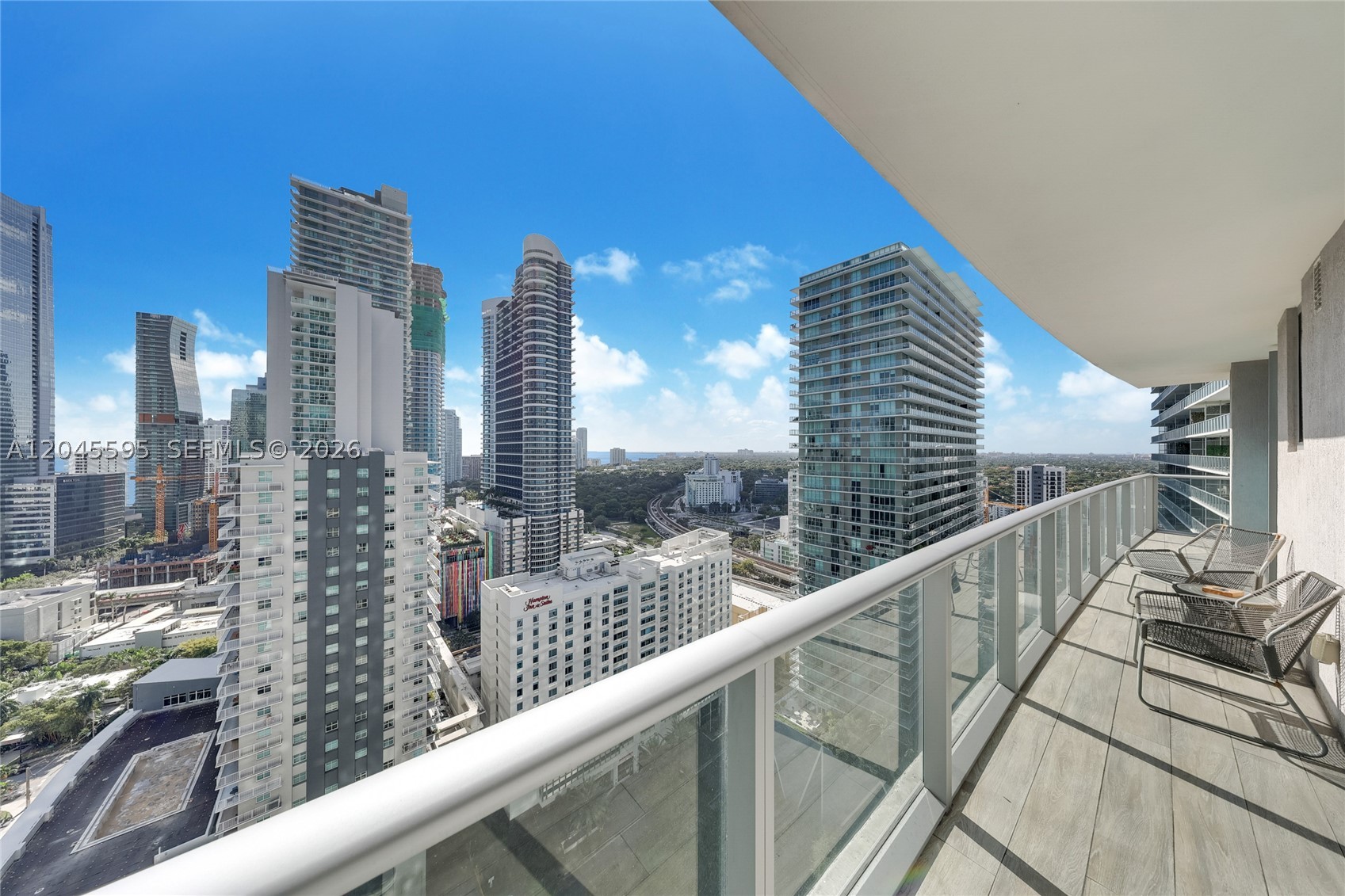 High above the urban core, this exclusive corner residence captures dramatic Brickell skyline vistas and features a spacious terrace designed for elevated city living. The interior is framed by floor-to-ceiling glass that floods the space with natural light, enhancing the open, airy layout throughout the day. Thoughtfully designed Italian cabinetry brings a refined, modern aesthetic to both the kitchen and bathroom, combining elegance with functionality. Residents of Millecento enjoy a full suite of resort-style amenities, including a state-of-the-art fitness center, spa, residents’ lounge and clubhouse, billiards room, business center, children’s play areas, and two swimming pools—one soaring on the 43rd floor with panoramic city views and another conveniently located on the 9th floor. Situated in the heart of Brickell, the residence is moments from Brickell City Centre, premier dining, vibrant cafés, everyday conveniences, and seamless access to Metrorail and Metromover stations, offering an unmatched urban lifestyle.
