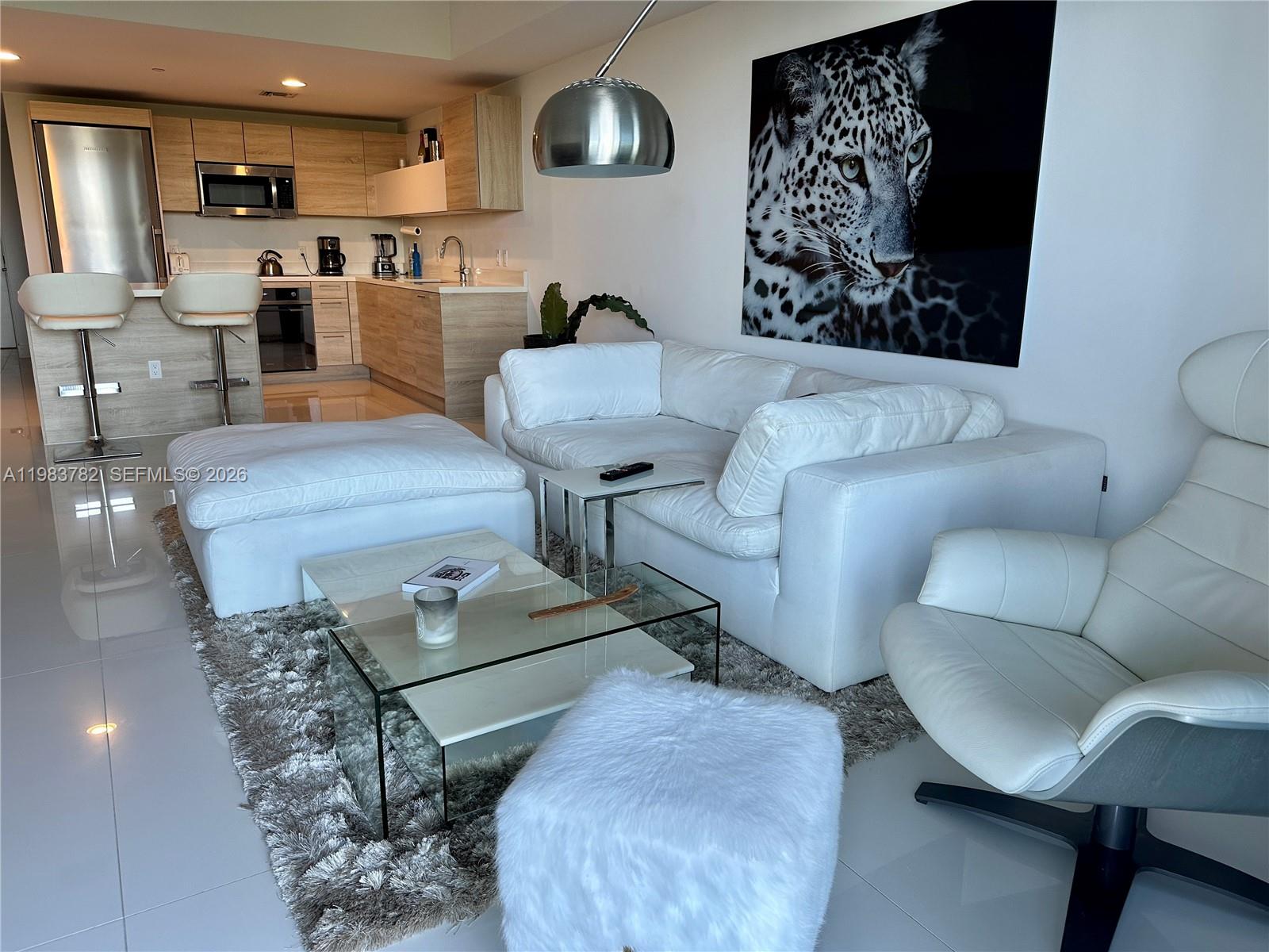 Experience waterfront living in this beautiful 2BD/2BA + den residence at The Harbour Condominium, offering stunning canal and bay views alongside the natural beauty of Oleta River State Park. A private elevator opens directly into the residence, revealing a bright and spacious layout with white porcelain tile floors, an open-concept kitchen, and an oversized balcony perfect for enjoying sunrise views over the water.

This residence includes two conveniently located parking spaces on the first level. The Harbour offers resort-style amenities including a private beach area, panoramic waterfront pool with cabanas, spa, sauna, state-of-the-art fitness center, kids’ room, basketball and soccer courts, 24-hour security, and valet service. Ideally located just minutes from Bal Harbour Shops, Aventura Mall, top restaurants, and beaches.
