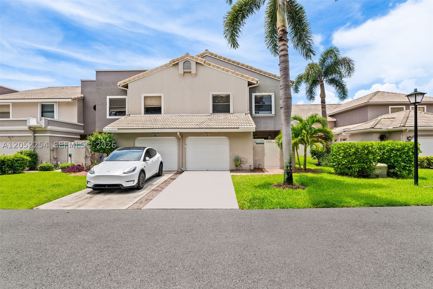 Welcome to 5285 Monterey Circle, a beautifully renovated waterfront corner-unit townhome in the gated community of Monterey Lake in central Delray Beach. Updated with over $125,000 in upgrades, this spacious three-bedroom, two-and-a-half-bath residence offers more than 2,000 square feet under air. Soaring 10-foot ceilings, abundant natural light and an open floor plan create a bright and inviting atmosphere. The home features brand-new porcelain wood-look tile flooring and a redesigned kitchen with quartzite/marble countertops, stainless steel appliances, an under-counter microwave and wine refrigerator. The bathrooms have also been beautifully renovated, and the bedrooms offer generous closet space.Enjoy year-round breezes and sunrise views from the screened-in waterfront lanai. Accordion shutters throughout provide added storm protection and convenience. The HOA includes roof maintenance, exterior painting, building insurance, lawn service, pest control, security, internet, cable and community amenities. Monterey Lake offers a remodeled clubhouse, resort-style pool, Jacuzzi, tennis, pickleball, basketball and fitness center. Zoned for A-rated schools and conveniently located near all that Delray Beach has to offer, this home delivers exceptional space, style and value.