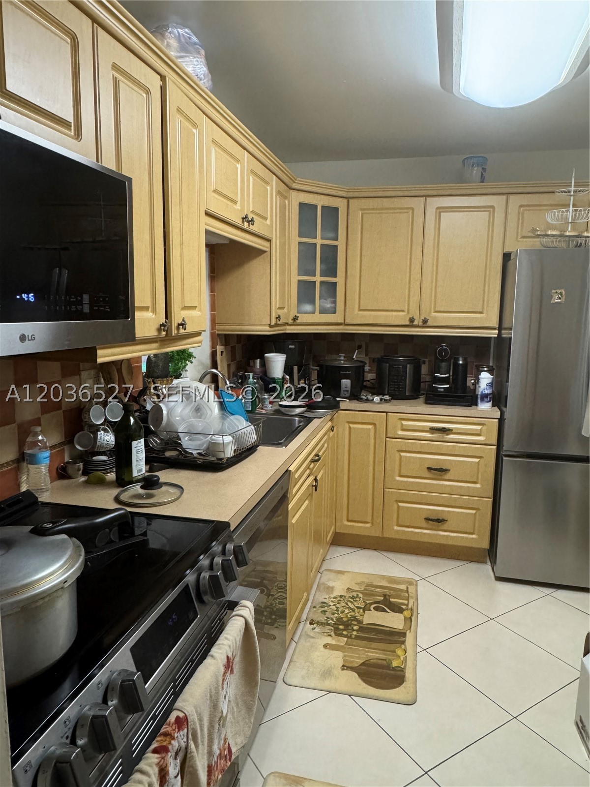 This is a very nice 2-bedroom, 2-bathroom corner condo featuring spacious rooms, remodeled bathrooms, a new A/C system, plenty of closet space, and a long private balcony. The unit offers granite countertops, tile flooring throughout, skylights, new appliances, and two storage rooms. Accordion hurricane shutters provide added protection and peace of mind. Conveniently located just minutes from the airport, shopping centers, restaurants, schools, Walmart, and Sam’s Club, with easy access to major expressways. This well-maintained unit is easy to rent and includes one assigned parking space plus ample guest parking. Wonderful location. Cash-only sale.