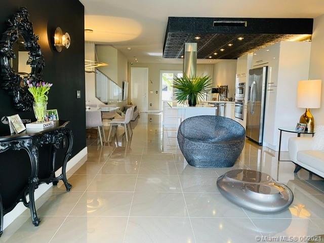 ULTRA CHIC AND UNIQUE TOWNHOME IN LANDMARK AT DORAL.  THIS 3 BEDROOM - 2.5 BATHS IS AMAZING.  SO MANY UPGRADES, COMPLETELY REMODELED- HIGH HAT LIGHTING THROUGHOUT DOWNSTAIRS AREA, STAIRS WITH GLASS HANDRAIL, BEAUTIFUL FLOORS, WALLPAPER,  UNIQUE LIGHTING FEATURES.   1/2 OF THE GARAGE HAS BEEN CONVERTED INTO A PLAYROOM.  HUGE WALK-IN CLOSETS IN THE MASTER BEDROOM.  THE SECOND WALKIN CLOSET HAS BEEN CONVERTED INTO A PRIVATE OFFICE.  UNIT HAS PARKING SPACE FOR TWO CARS IN THE BACK AND STILL SOME SPACE IN THE  GARAGE FOR OWNERS TO UTILIZE AS STORAGE/GARAGE AREA.  A LUXURY COMMUNITY CLUBHOUSE WITH FITNESS, AN AMAZING POOL, PLAYGROUND AREA, TENNIS COURTS, AND MUCH MORE!  LIFESTYLE AT ITS BEST.