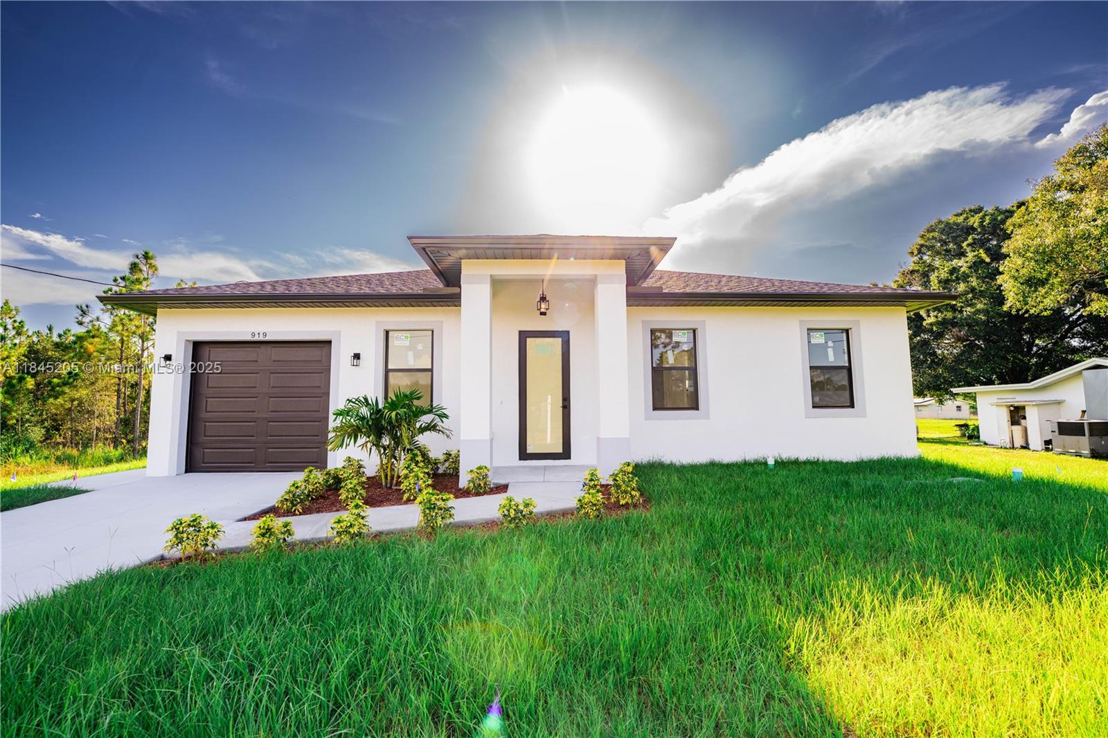 New Construction Home on Half Acre in Lehigh Acres.  Brand new and ready for move-in! This stunning new construction home is situated on a spacious half-acre lot in the heart of Lehigh Acres. Featuring 3 bedrooms, 3 bathrooms, and a single-car garage, this property offers the perfect blend of modern design and functional living.  Step into a large, contemporary kitchen outfitted with sleek quartz countertops, stainless steel appliances, and ample cabinetry—ideal for both everyday living and entertaining. With quality craftsmanship throughout, this home delivers comfort, space, and style on a generously sized lot with room for future additions like a pool or guest house.  Perfect for homeowners or investors looking for a high-quality build in a rapidly growing area!