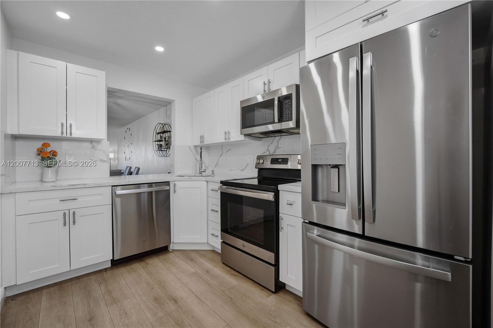 55+ COMUNITY CONDO located in Sunrise, offering 1,162 sq. ft. of comfortable living space and ready for immediate move-in. This 2-bedroom, 2-bathroom unit has been fully remodeled, featuring a modern kitchen with Stainless-steel appliances, generous cabinet space, and sleek recessed lighting. Both bedrooms are spacious and include walk-in closets, providing plenty of storage. The bathrooms have been tastefully updated with contemporary finishes, including dual sinks in the primary bathroom. The enclosed balcony adds extra-living space—perfect for relaxing, watching TV, or spending quality time. Residents can enjoy community amenities such as a pool, clubhouse, laundry facilities on every floor, additional personal storage, and ample guest parking.
This is one of the larger units available in the area, competitively priced, and ideal for a new family who will truly appreciate the care and upgrades that have gone into this beautifully remodeled home. Seller is open to including the furniture. Move in ready convenience for the buyer.