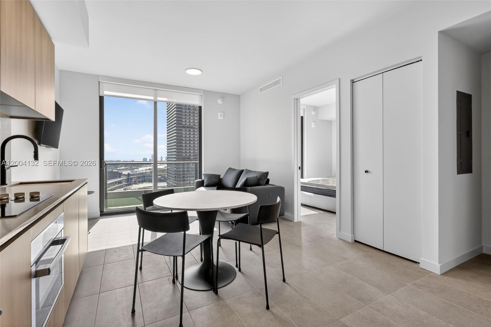 Elevated city living at 501 First Residences, a striking 40-story address in Downtown Miami with no rental restrictions and exceptional income potential. This fully furnished 591 sq ft one-bedroom, 1.5-bath east-facing residence captures sweeping skyline and bay views, including the iconic Freedom Tower, PortMiami, and Biscayne Bay. Floor-to-ceiling glass, a private balcony, refined finishes, Italian cabinetry, and in-unit washer/dryer define the interiors. Moments from Miami Worldcenter, dining, culture, and transit. Indulge in 20,000+ sq ft of curated amenities including rooftop pool, fitness center, co-working spaces, club suite, and 24/7 valet.