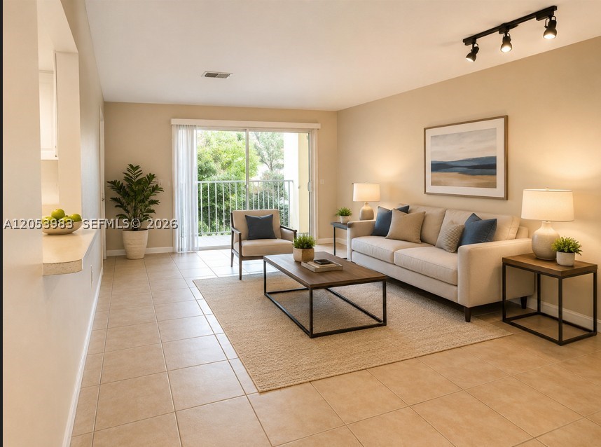 Bright and spacious 3-bedroom, 2-bath condo in Villa Encantada Community. Tile floors throughout,  laundry inside the unit. , Assigned parking spaces plus guest parking with decal. Community pool available to enjoy. Located near shopping, schools, restaurants, emergency room, bus, highways, and Zoo Miami.