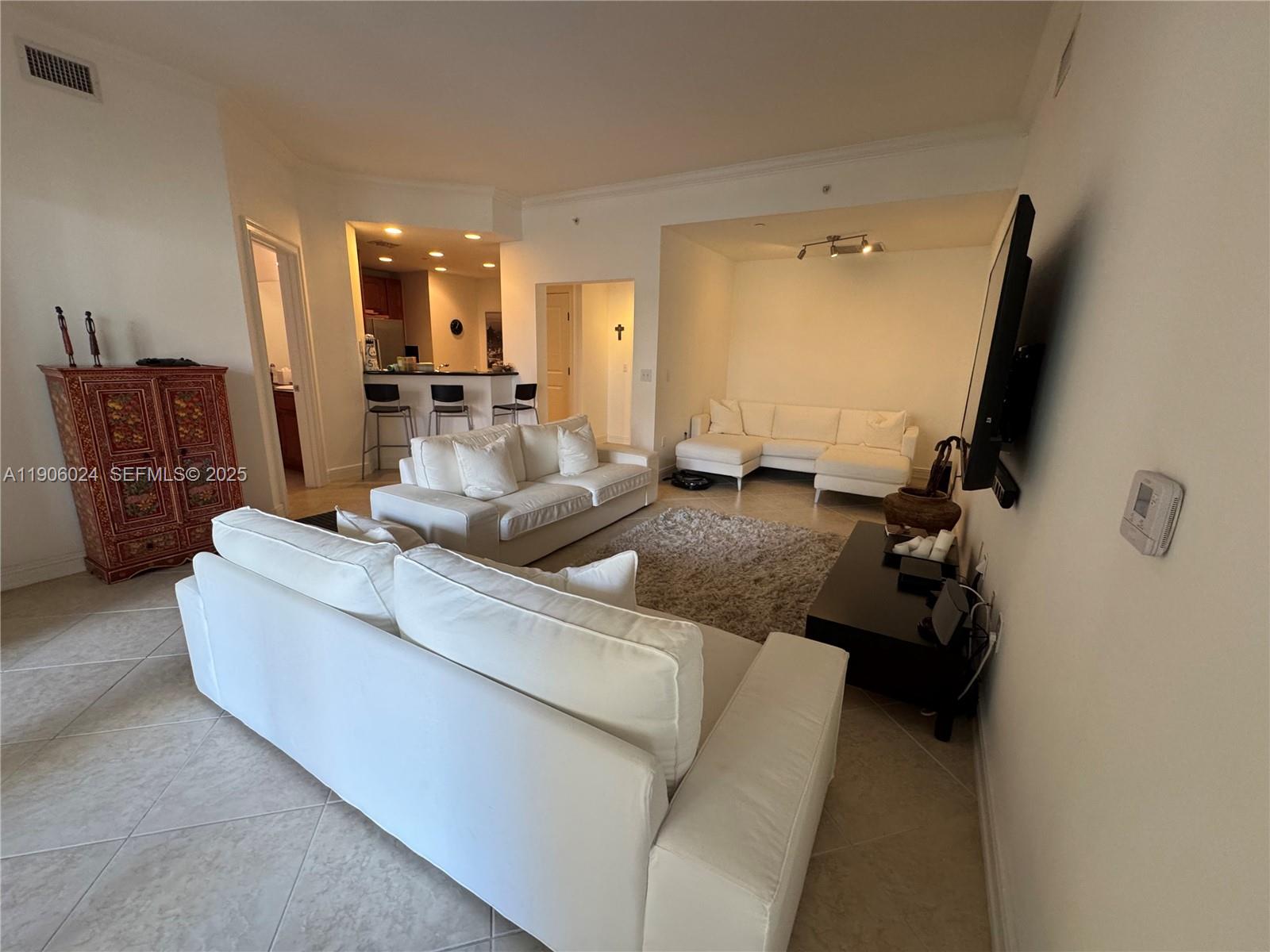 Experience luxury living in this  2BR/2BA condo featuring stylish designer furniture and an open-concept layout with contemporary finishes. The gourmet kitchen offers stainless steel appliances, granite countertops, ample cabinetry, and a large pantry. Primary suite includes dual vanities, jacuzzi tub, separate shower, and walk-in closet. Enjoy tranquil garden views from your private balcony. Full-size laundry, impact windows, same-floor storage. Resort-style 55+ community with valet, pool, spa, gym, clubhouse, on-site restaurant & more. Water, cable, internet, and $180 quarterly dining credit included. Prime location near I-75, shopping & dining.