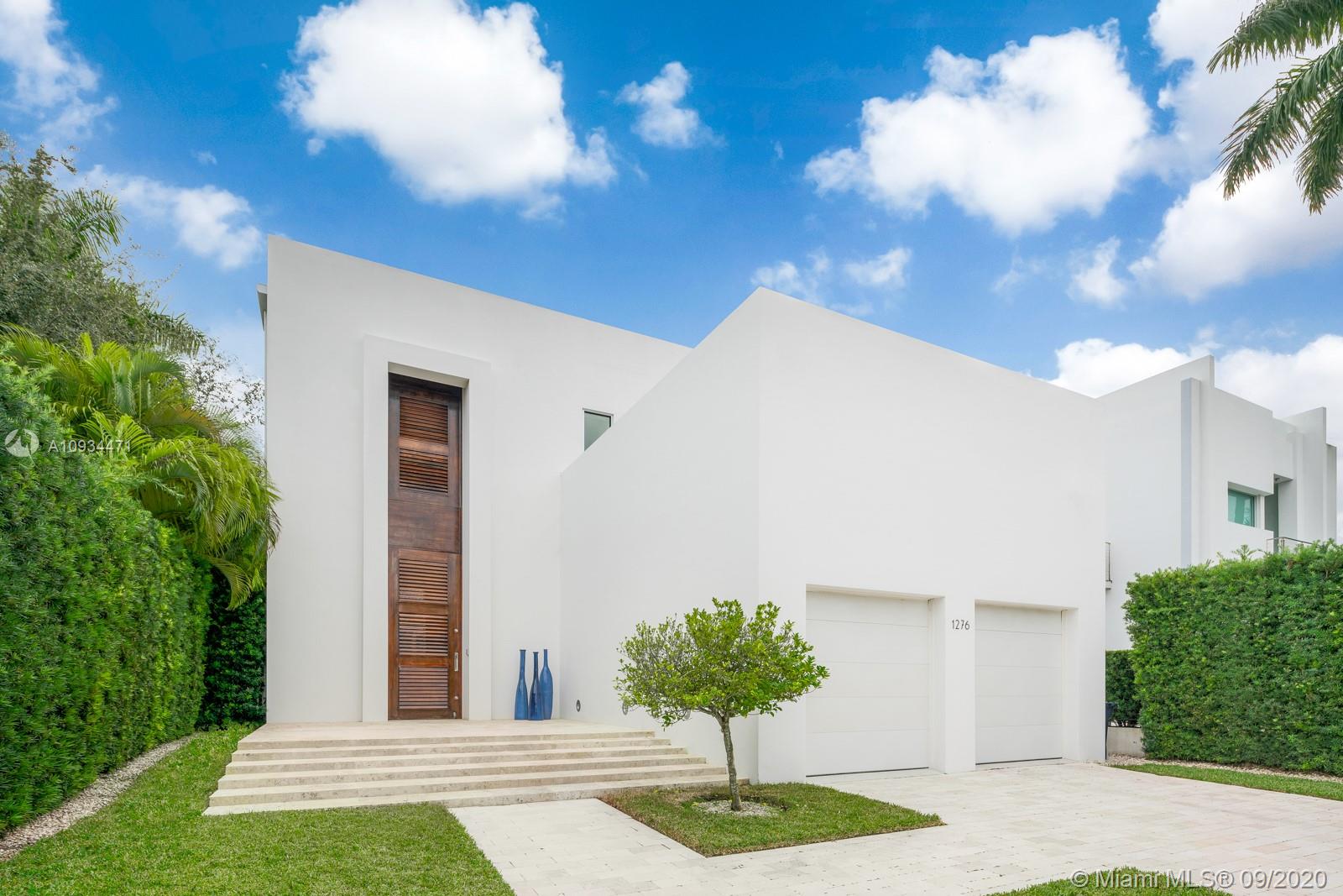 This architectural beauty is located in the secret and peaceful Isle of Biscaya, Surfside. The residence has amazing natural light provided by the stackable sliding glass doors. It has a75 feet Infinity lap pool with a waterfall. Six bedrooms, six and one half bathrooms including a coral stone cabana bathroom.
High end finishes all through out the house, 12 feet ceilings, limestone floors, elevator, coral stone walls, gourmet kitchen with Italian expansive cabinetry and large island, Italian made walking master closet, outdoor kitchen with BBQ, lounge area with a gas fire pit covered by a palm tree oasis, new Ipe wood dock, sunset terrace, two car garage, pantry, storage rooms. Beach at a walking distance. Actual 5721feet. Lot: 50 x 200 (10,000)