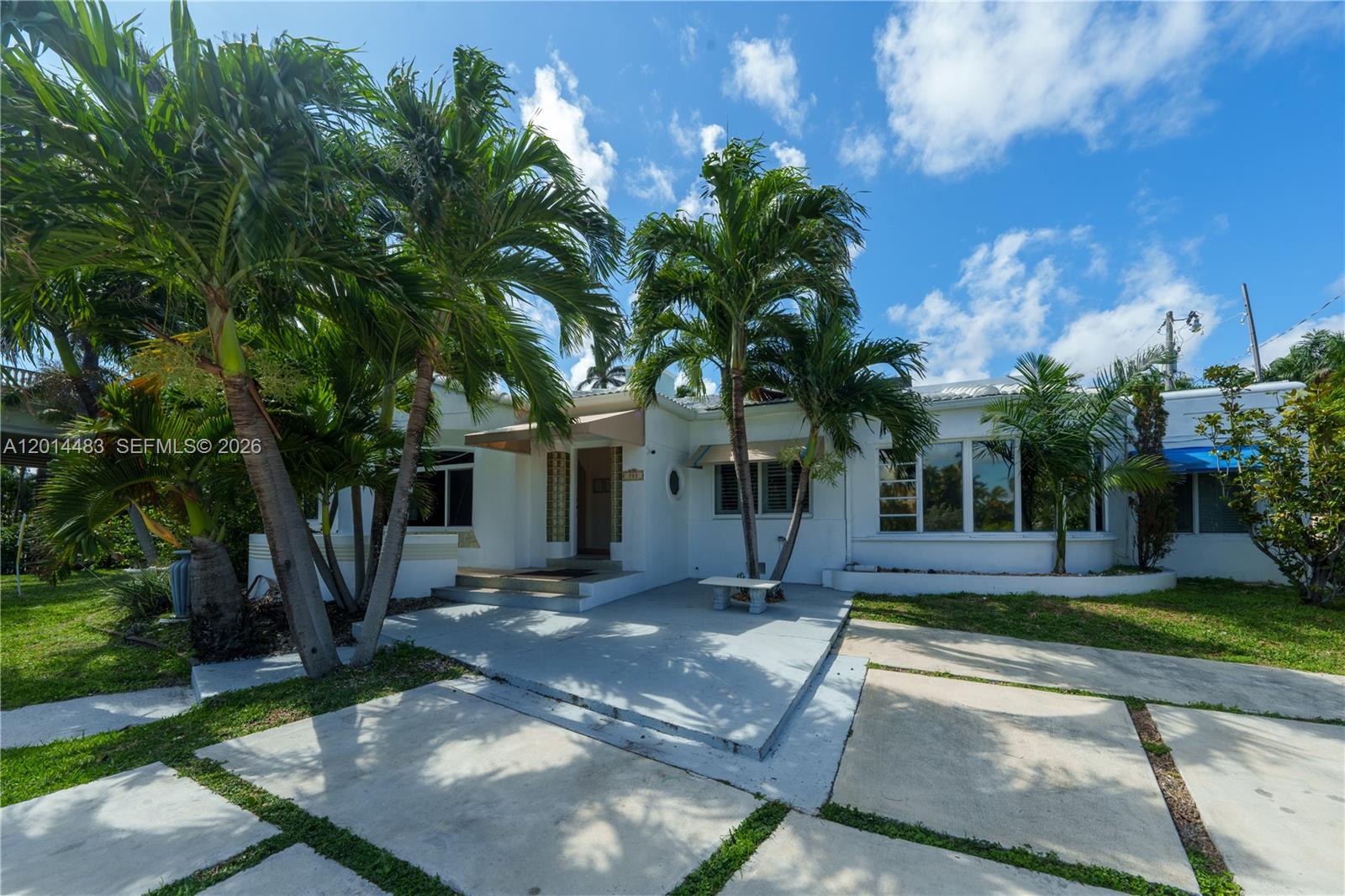 PRICED TO SELL! Just steps from Hollywood Beach and the famous Boardwalk, THIS IS ONE THE BIGGEST LOTS WITH A HOME featuring a spacious 5 bedroom 3 bathroom waterfront retreat that blends comfort, style & fun. With over 3,000 SF plus a detached in-law suite, it’s perfect for large groups or guests seeking privacy. Enjoy stunning intracoastal views right from your living room, an above-ground pool, rooftop terrace, patio for al fresco dining, and even mini golf. Recent updates include renovated kitchen and hallway floors (2022) and a new parking area for up to six vehicles. Ideal for creating unforgettable memories in East Hollywood.