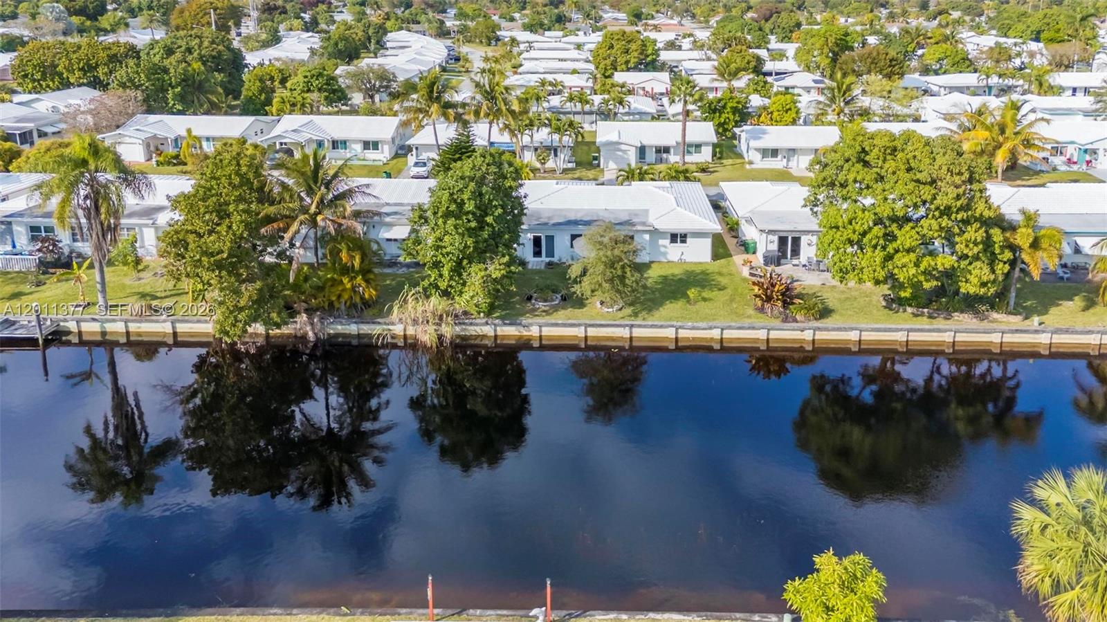 Spacious and beautifully upgraded 3BR/2BA home in a desirable 55+ community offering serene water views and modern comfort throughout. The residence features wood-look laminate flooring in every room, creating a warm and cohesive feel across the home. Major UPDATES INCLUDE A ROOF (2019), IMPACT WINDOWS, and a hurricane-rated garage door, providing both security and peace of mind. The home also features stainless steel appliances and washer/dryer (2020) for added convenience. The primary suite has been enhanced with an UPDATED primary bathroom and a custom-made closet, offering both style and functionality. Additional features include electrical blinds, enhanced exterior lighting, and a freshly painted driveway, adding to the home’s polished appearance. Residents enjoy a low HOA with access to community amenities including a pool, clubhouse, and picnic area, all within a welcoming and active adult community. A perfect blend of upgrades, lifestyle, security, and value.
