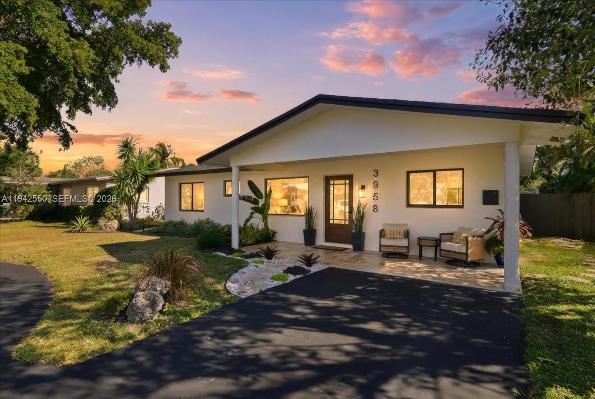 Beautifully remodeled 4-bedroom, 2-bath ranch-style home featuring a bright open floor plan and sleek modern finishes throughout. The 4th bedroom is being used as a den/TV room. The European-inspired kitchen is a showstopper, equipped with state-of-the-art appliances and designed for both everyday living and entertaining. Enjoy peace of mind with a brand-new roof, impact windows and doors, a stunning custom front door, newer A/C, and tankless water heater. Step outside to a cozy backyard oasis with a gorgeous pool area, perfect for relaxing or hosting guests. Additional features include an EV charging station and exceptional curb appeal. Located in a private neighborhood with easy access to I-95 and just minutes from Wilton Manors, dining, shopping, and more. This move-in-ready home offers the perfect blend of style, comfort, and convenience.
