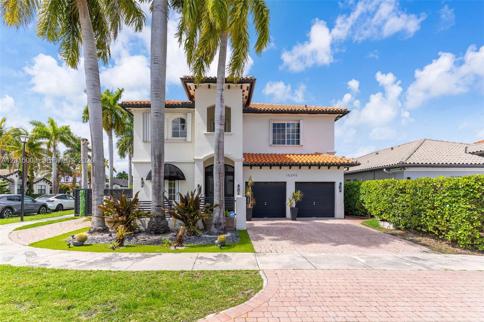 Beautiful corner lot 5-bedroom, 4-bathroom residence in a desirable location, offered move-in ready with no HOA. The home features elegant tile flooring throughout the first floor, wood staircase, and vinyl flooring on the second level. Outdoor living is highlighted by a sparkling pool and jacuzzi, summer kitchen, travertine pool deck, and paver driveway, creating an ideal setting for relaxation and entertaining.  A rare opportunity to own a spacious, stylish home in an excellent location.