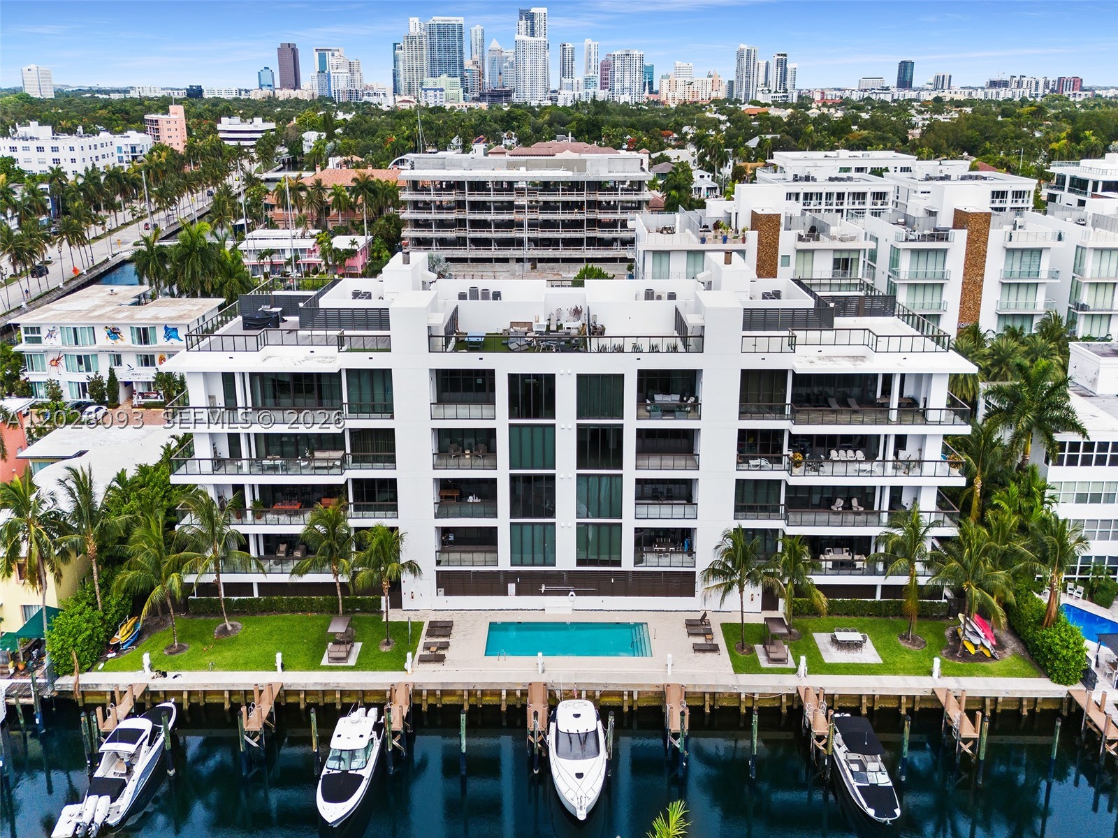 AquaLuna on the Isle of Venice, where Las Olas Blvd, the ocean, & a life well-lived are all just steps from your door. This 2 bedroom + office, 2 bathroom residence is effortless luxury. 10' ceilings & crisp white walls create an airy, light-filled interior, the east-facing exposure draws in fabulous natural daylight from morning through afternoon. As the sun sets, the downtown skyline is a view that never gets old. Move-in ready and thoughtfully designed as a neutral canvas, the interiors are yours to personalize from day one. The chef's kitchen is impeccable with a Wolf six-burner gas range, Sub-Zero refrigerator, and plenty of prep space, perfect whether you cook every night or entertain on occasion. A full-size laundry room, open floor plan, & electric shades throughout make this space as functional as it is beautiful. The primary suite is a true retreat, anchored by a dramatically upgraded bathroom finished in sleek black modern stone & lg walk-in closets. Located at 30 Isle of Venice, this residence is part of AquaLuna -  an intimate community of two boutique buildings, each with just 8 residences. A private elevator opens directly into your private foyer, and 2 assigned covered parking spots complete a level of exclusivity and peace that is genuinely rare in condominium living. A whole-building generator means you never have to think twice about storm season. Outside, the lifestyle just gets better. Your private dock fits a vessel up to 37', the ocean is just minutes away. The pool is steps from your door, &  above it all, your private rooftop entertaining area is perfect for sunset gatherings and dinners under the stars. Walk, bike, or golf cart to world-class dining, shopping, & beach. Your Fort Lauderdale waterfront life is ready. Schedule your private showing today.