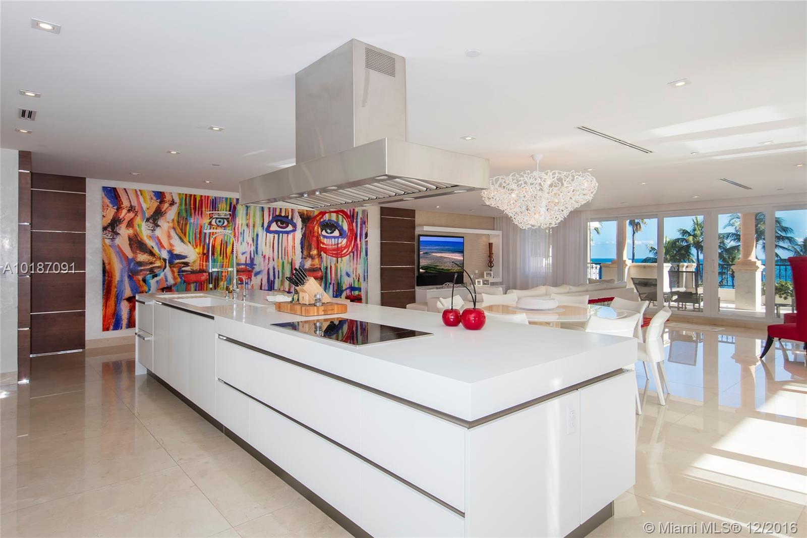 This stunning Oceanside residence is truly a work of art. This chic/modern home boast 3,140 SF of impeccably designed interior w/crema marfil marble floors, spacious open living & dining layout, custom built kitchen & walls of glass w/ocean views. Spectacular master suite w/custom closet spaces, private balcony & mater bath w/Carrera marble. The other 2 bedrms are expertly designed w/full en-suite baths.  Lrg wrapping balcony w/beach & ocean views, plus 2 priv. balconies w/views to the golf.