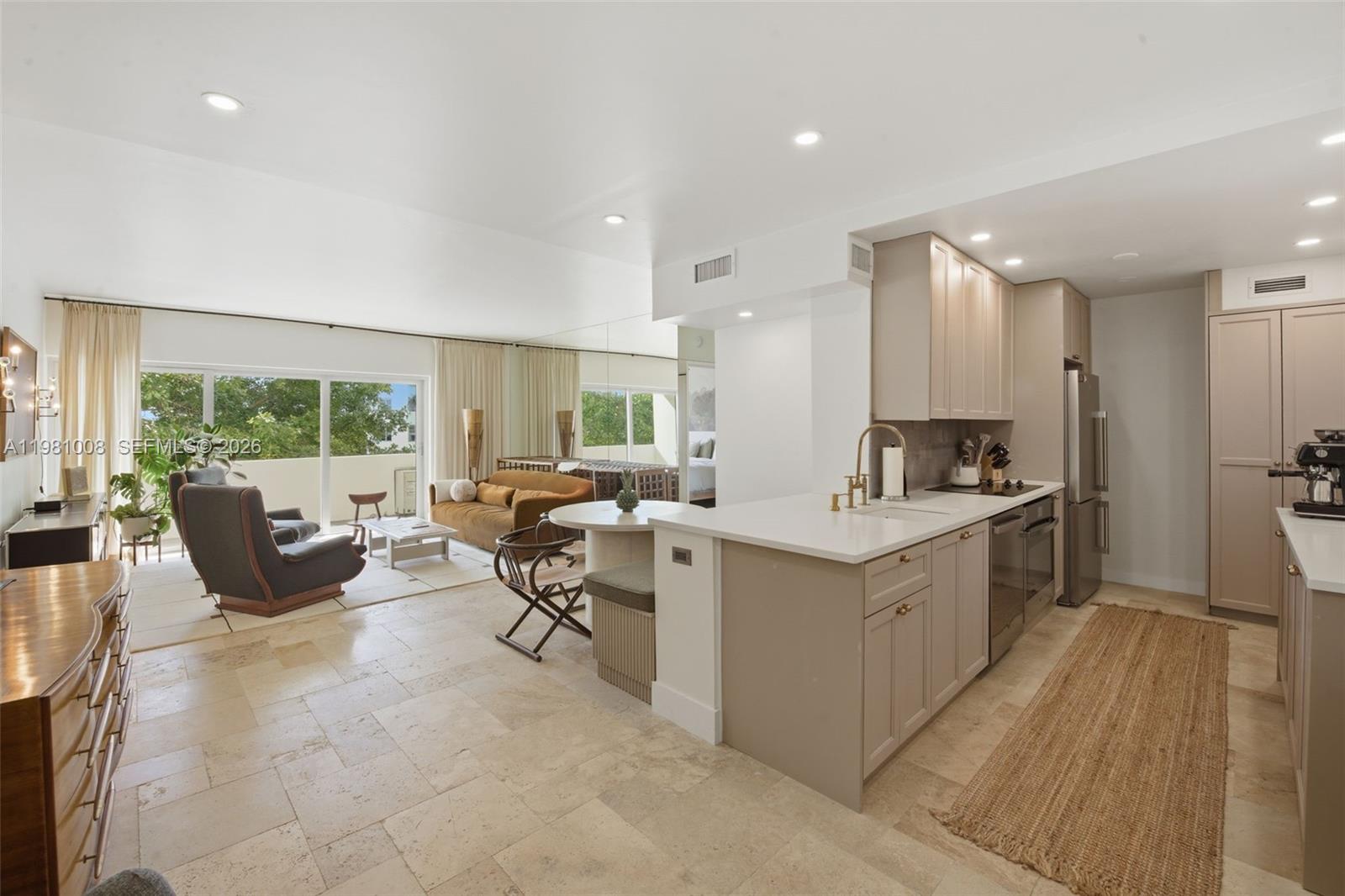 Residence 6K at 3 Island Avenue captures the essence of classic Miami Beach sophistication in one of Belle Isle’s most iconic Morris Lapidus–designed buildings. This beautifully positioned one-bedroom residence offers private treetop views from your private open balcony. The spacious layout features approximately 861 square feet of refined living, with expansive windows that flood the home with natural light. A thoughtfully updated kitchen and bath complement elegant finishes throughout, creating a move-in-ready retreat. Residents enjoy a full-service boutique building with 24-hour doorman, bayfront pool, waterfront deck, and marina access. Ideally located moments from Sunset Harbour, Lincoln Road, and South Beach’s celebrated dining, wellness studios, and cafés—this is timeless Miami living at its finest.
