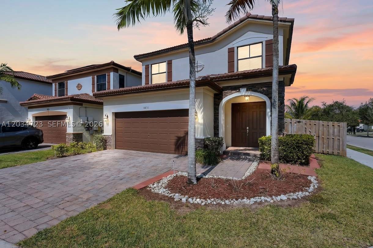 Corner-lot gem in Doral's most sought-after gated community! This stunning 4BD/3BA Middleton model offers 2,548 SF of refined living on a Premium 4,891 SF corner lot — one of the few homes perfectly positioned across from a serene lakeside park, delivering beautiful water views and an exceptional sense of openness right from your front door. The thoughtfully designed floor plan features one bedroom and a full bath on the first floor, ideal for guests, multi-generational living, or a home office. The spacious kitchen boasts granite countertops, stainless steel appliances, a double oven, wine cooler, and ample cabinetry, seamlessly connecting to the family room for effortless entertaining. Upstairs, the oversized primary suite showcases a coffered ceiling and dual walk-in closets, with a conveniently located second-floor laundry room. The expansive corner lot offers endless possibilities: pool, spa, summer kitchen, gazebo, playground, or your own private outdoor retreat. Residents enjoy a spectacular multi-million-dollar resort clubhouse with beach-entry pool, jacuzzi, children's water park, fitness center, spa, tennis & basketball courts, and cabanas. 24-hour guard-gated, A+ rated schools. Minutes from Publix, Downtown Doral, CityPlace, Dolphin Mall, International Mall, Jackson West Medical Center, Miami International Airport, Florida's Turnpike, and SR-826. Welcome to the lifestyle that makes Doral one of South Florida's most desirable places to call home. Contact us today!