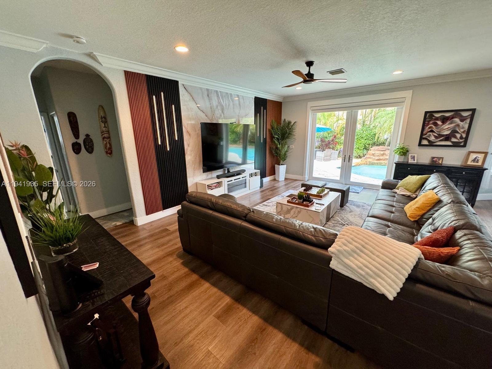 Welcome to your dream home! This beautifully remodeled 5-bedroom, 3-bathroom home, featuring an amazing pool and waterfall, is nestled in a private, beautifully landscaped tropical oasis on a spacious corner lot in a quiet, well-maintained neighborhood with low HOA fees. Completely remodeled bathrooms, an elegantly designed kitchen, a spacious family room, and a stunning two-story living room with a water filtration system, air purifier, and automatic air conditioning drain cleaning system are included. High-impact, energy-efficient windows and doors are also featured. A 3-car garage with a race deck floor and air conditioning is provided. There is also a community pool, fitness center, social club, tennis courts, pickleball courts, and a playground. Don't miss this opportunity!