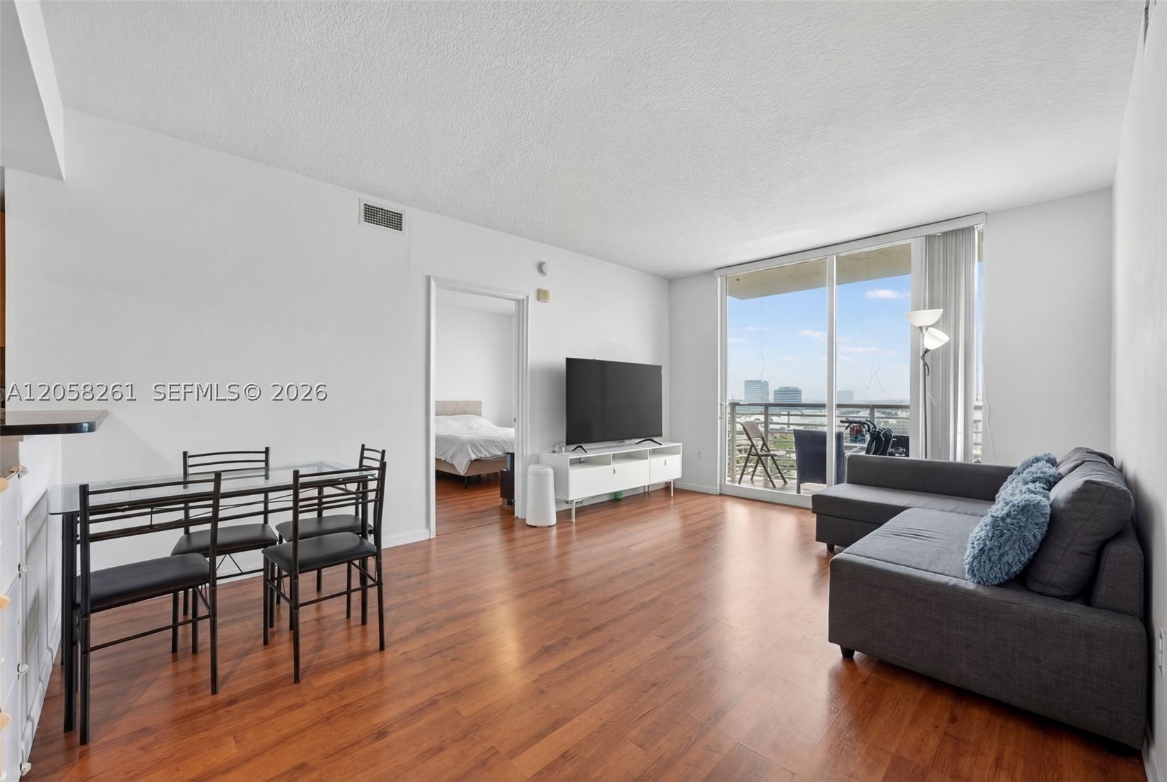 Beautifully updated 2-bedroom, 2-bath residence in the highly desirable The Venture at Aventura East. This bright and modern condo offers an open-concept kitchen with granite countertops and stainless-steel appliances, complemented by stylish laminate wood flooring throughout. The split floor plan provides spacious bedrooms and well-appointed bathrooms, along with the convenience of an in-unit washer and dryer and generous closet space. Enjoy stunning views of the pool area and surrounding skyline from this impressive unit. Residents have access to a wide range of luxury amenities, including multiple infinity pools, a full-service spa, state-of-the-art fitness center, business center, and a private theater room. An excellent opportunity for both investors and end users. Easy to show.