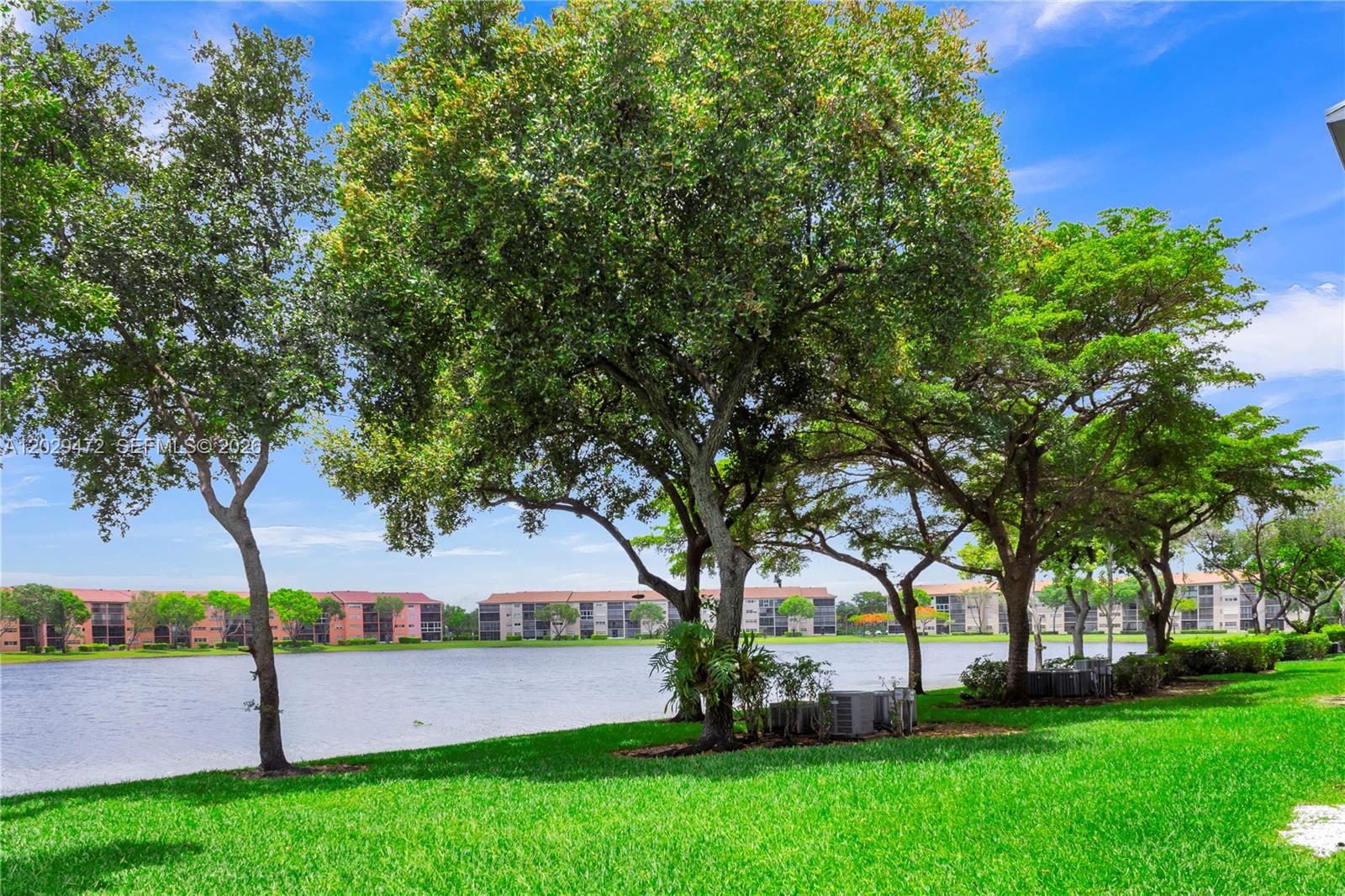 Very desirable 2nd floor unit. Big master bedroom with 2 spacious walk-in closets. Laminate floors, newer washer/dryer and refrigerator. Lovely lake view. The community has endless resort-style amenities with clubhouse, transportation, 24-hour security, pharmacy, nurses on-call and medical center; pickleball courts, pools, gyms, theatre, cafe, golf course and so much more!