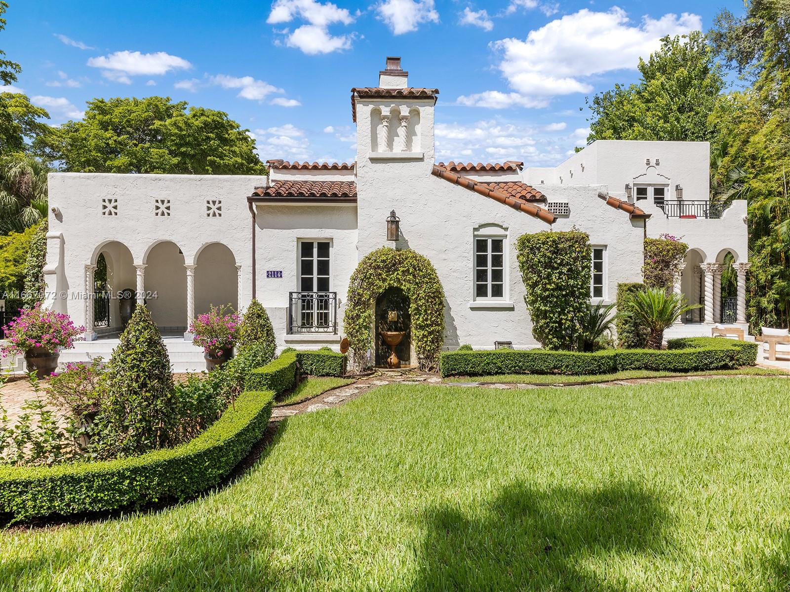 Welcome to a remarkable historical estate in Coral Gables, perfectly situated next to the Granada Golf Course and tennis courts. This luxurious home combines classic elegance and historic touches, featuring stunning white oak flooring, marble and porcelain bathrooms, and a gourmet kitchen. The spacious bedroom suites offer exceptional comfort. Sustainability is a key highlight, with solar panels providing clean energy, while advanced technology ensures convenience throughout. The expansive outdoor spaces are surrounded by lush greenery, ideal for relaxation and entertaining. For added peace of mind, the estate includes top-notch security features. A two-car garage with extra storage completes this exceptional property. Experience the perfect blend of historic charm and modern luxury.
