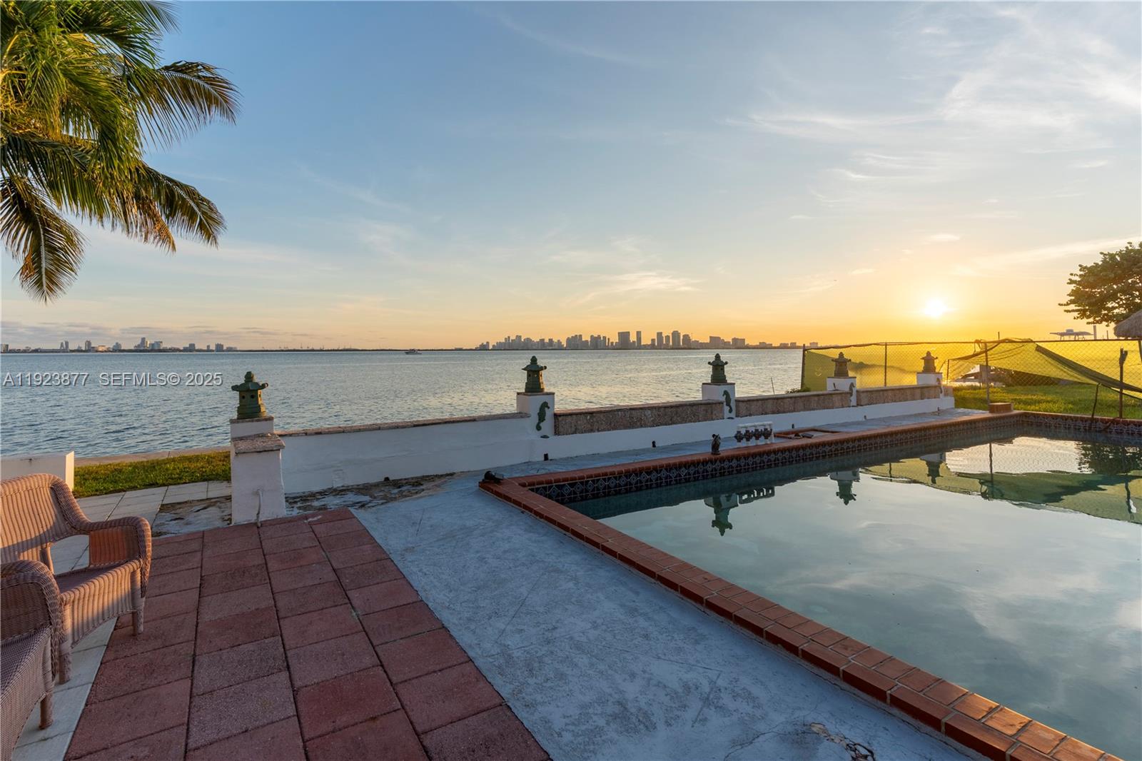 Stunning waterfront property on Treasure Island offering SPECTACULAR PANORAMIC VIEWS of Biscayne Bay, the
Miami skyline, and Miami Beach!! Arguably some of the best views in Miami! With 60 ft of direct bay frontage, no fixed bridges, and wideopen ocean access, this property is ideal for boating enthusiasts. The 4-bed, 4-bath residence sits on a 9,000 SF lot and features vintage Cuban tiles and hardwood floors. Enjoy as is, renovate, or redevelop into your dream estate with some of the best views in Miami. Just blocks from Normandy Shores Golf Course. Unforgettable sunsets and 180 degree unobstructed vistas - an exceptional opportunity.
