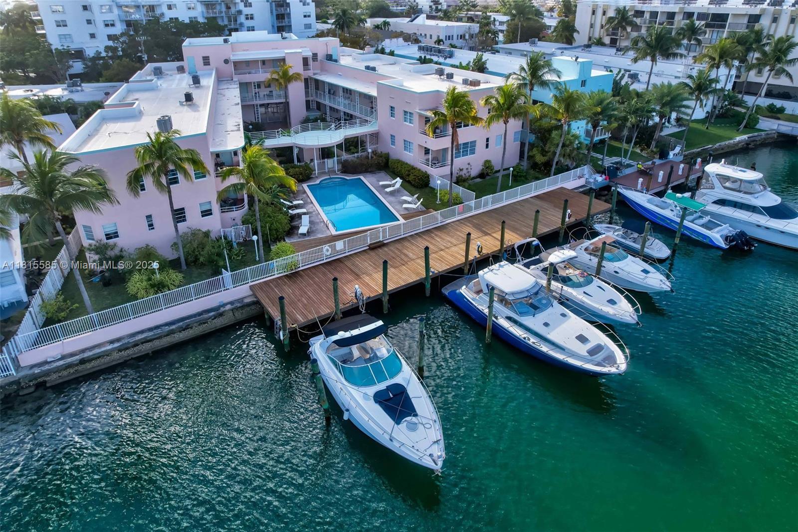 Apartment #7 is available for rent at this Normandy Isle Gem! It features the coveted amenity for renting a boat dock for boats up to 44 feet. Just half a mile from the beach, this boutique building recently completed its 40-year recertification and a brand-new seawall and dock. This 1st-floor one-bedroom plus den (easily used as a 2nd bedroom) features new kitchen appliances, a remodeled bathroom, skim-coated ceilings and walls, cedar-lined closets, designer lighting, and original Florida pine hardwood floors. Enjoy views of Biscayne Bay from the spacious front terrace. Building features include a laundry room, kayak/SUP storage, and a secure bike area. With a local market, bars, and restaurants a short stroll away, this is Miami coastal living at its best. Pets allowed with certificate.