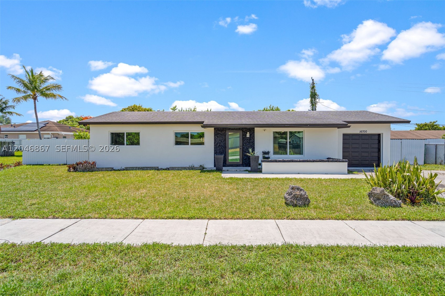 Beautifully maintained 3-bedroom, 2-bathroom home with no HOA! Features tile and wood flooring throughout, an updated kitchen with quartz countertops and modern cabinetry, a newer A/C (approx. 4 years old), a 9-year-old roof, and fresh exterior paint. Enjoy the screened-in patio overlooking a spacious, large backyard. Conveniently located near shopping, dining, schools, and major roadways—this move-in-ready home is a must-see!
