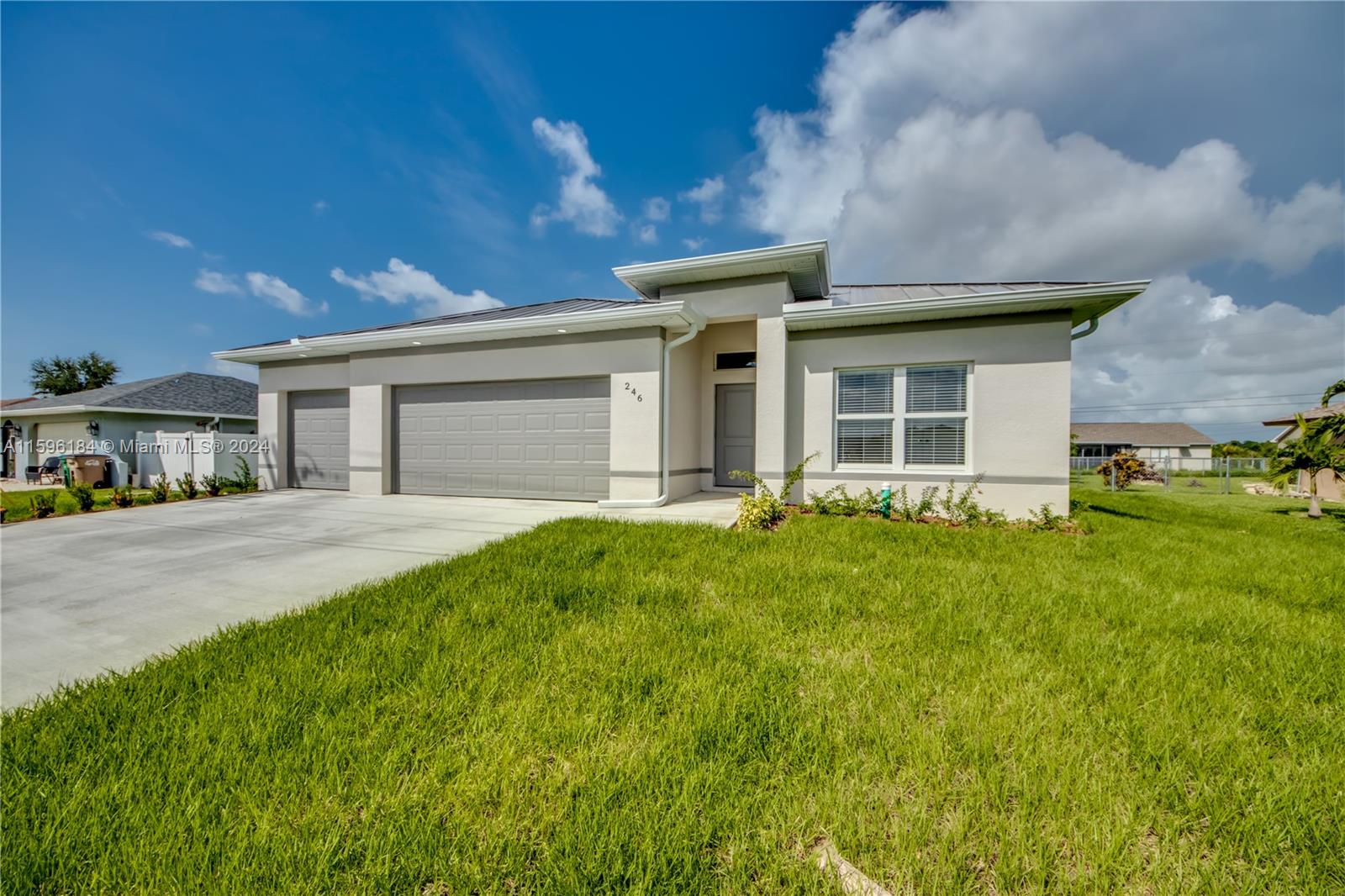 *Seller will contribute $10,000 in closing costs and provide buyer with a 2-10 home warranty.* New construction home with a 3 car garage, metal roof, & above grade high impact windows & doors. Home is on city water, sewer, and irrigation! The kitchen features granite countertops, subway tile backsplash, stainless steel appliances, 42-inch cabinets & large kitchen bar. The primary bathroom includes double sinks, granite countertops, a tiled shower with glass door, and a large walk-in closet. The second bathroom also includes granite countertops and a tiled shower/tub combo. This home boasts tons of upgrades and other features including beautiful vinyl flooring throughout, vaulted ceilings, a screened-in lanai, & lots of storage space. Washer & dryer included. No HOA. Not in a flood zone.