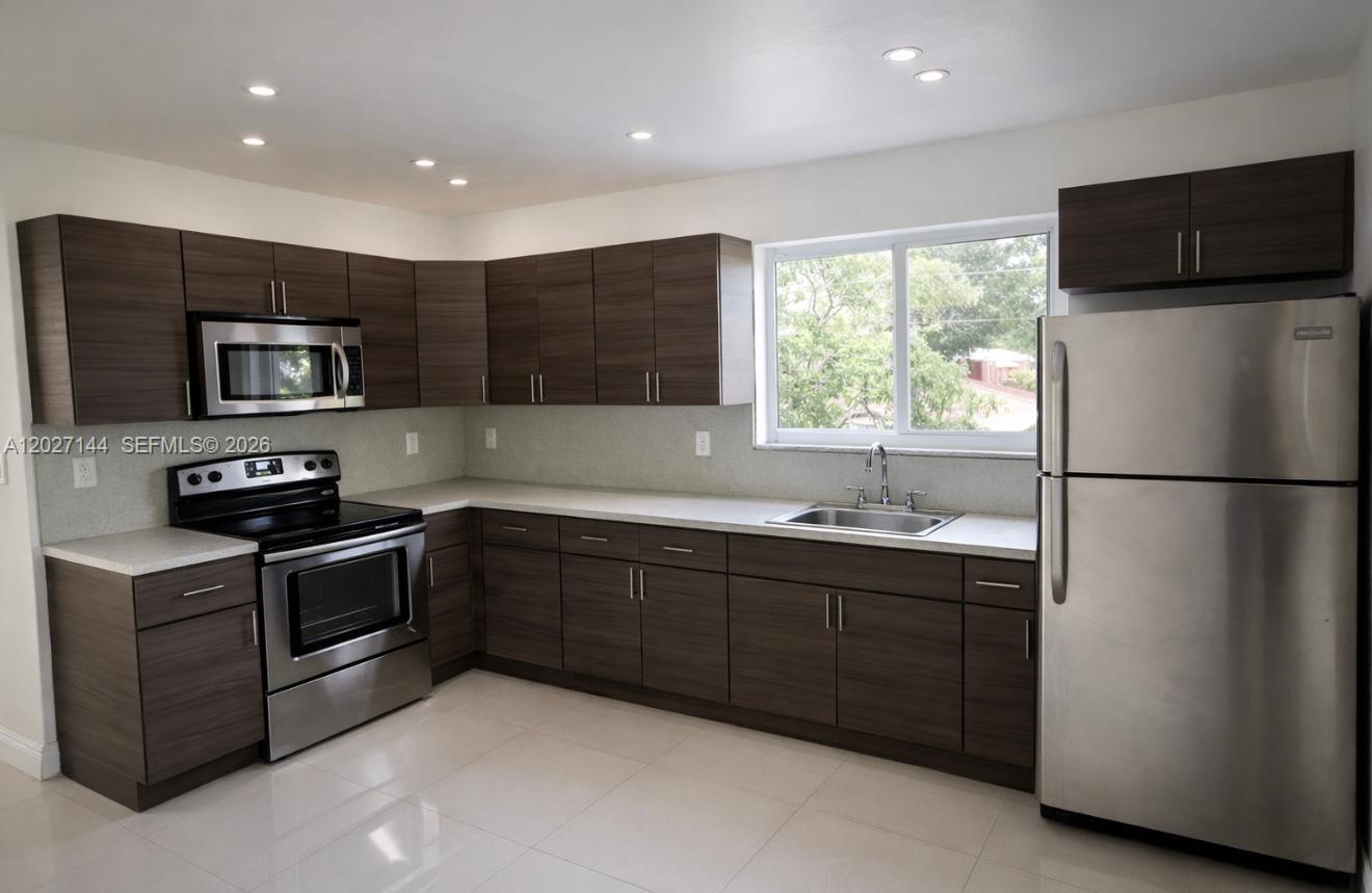 Spacious 2 Bedroom 1 bathroom unit features one assigned parking space, on-site laundry access, modern design kitchen, stainless steel appliances and dishwasher, tile flooring, impact windows and central ac. Apartment also offers a private fenced yard adds rare outdoor space for relaxation or entertaining. Located in the heart of the Mimo District. Minutes from dining, shopping, and beach. RAPID APPROVAL!