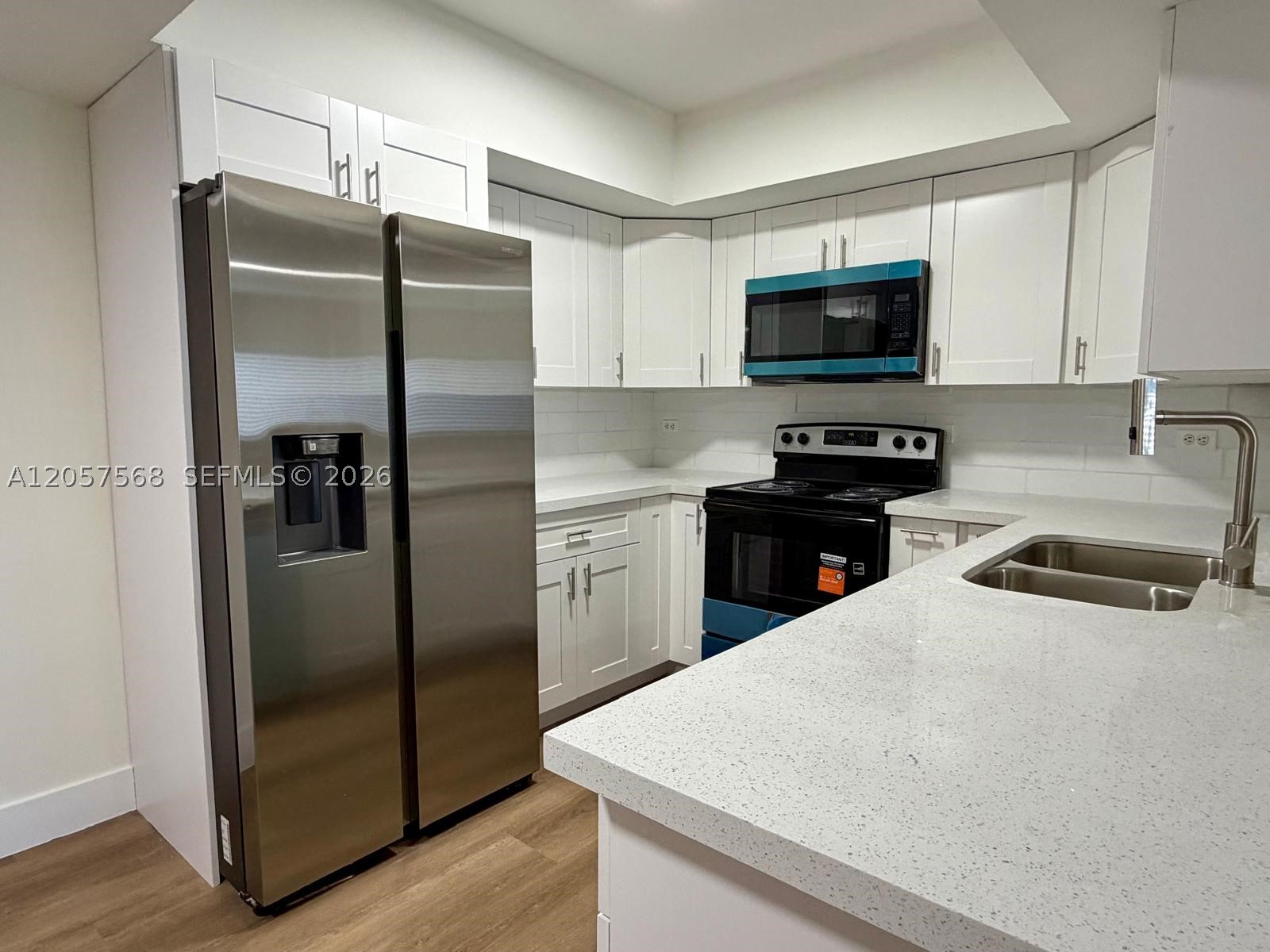 Gated community with Gym, Pool, and playground.  Featuring a fully remodeled unit on First floor, with LVT floors throughout the entire unit.  Brand new appliances, washer & dryer in unit. Plenty of closet space. Lakewood at Emerald is located near a shopping center, minutes from Sheridan st & Hard Rock Casino. Small pets allowed, non-aggressive breeds w $300 non-refundable deposit. Ready and available for immediate occupancy. Association process takes only 48hrs. EASY TO SHOW ON LOCKOBOX
